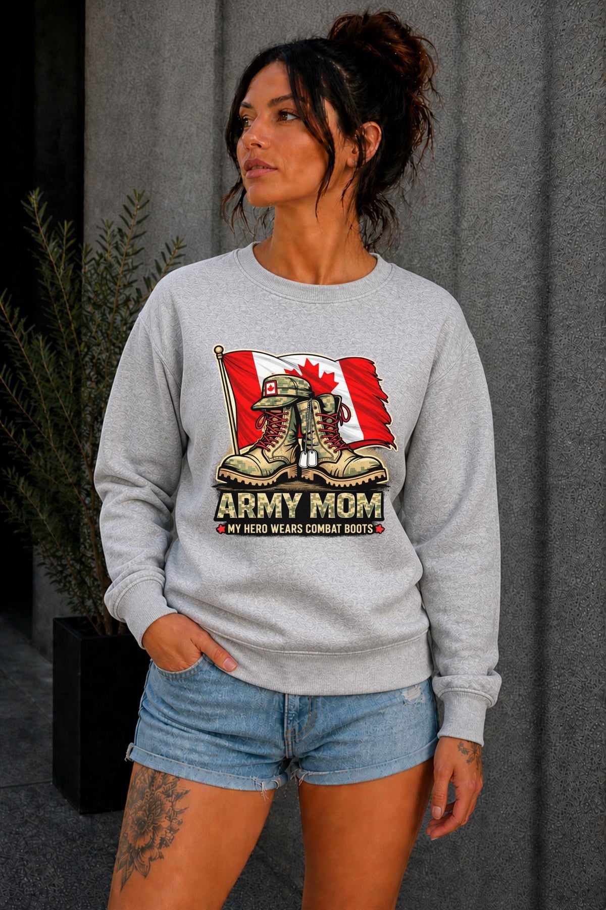 Woman wearing black crewneck sweatshirt with Army Mom design featuring combat boots and Canadian flag, patriotic military mom sweater, casual fall outfit