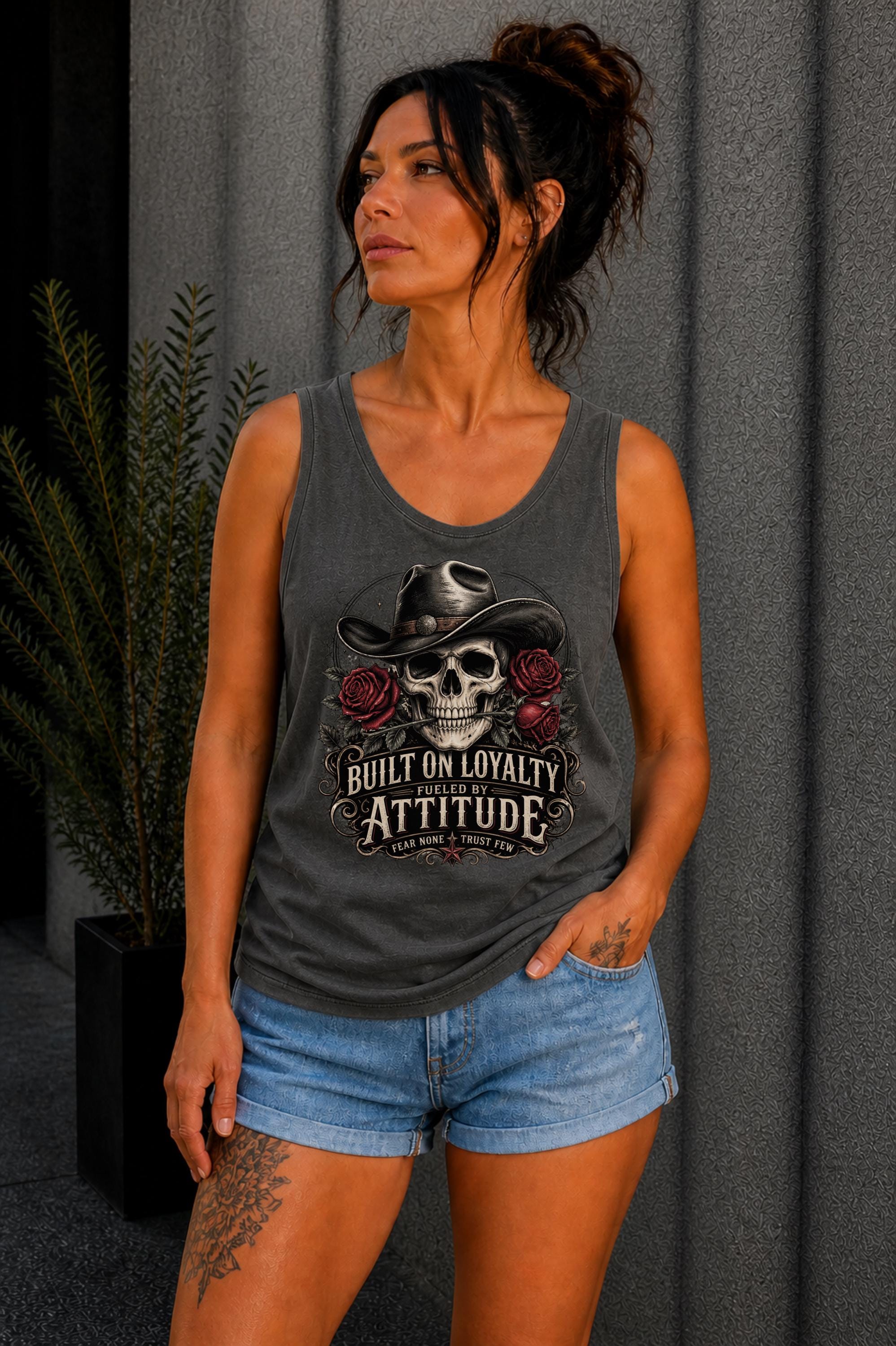 Tank-Top featuring cowboy skull with hat and red roses, Built on Loyalty Fueled by Attitude graphic, styled with edgy casual outfit
