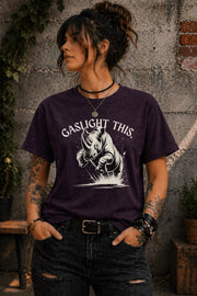 Edgy woman model in ripped jeans wearing funny gaslight this slogan shirt lifestyle mockup