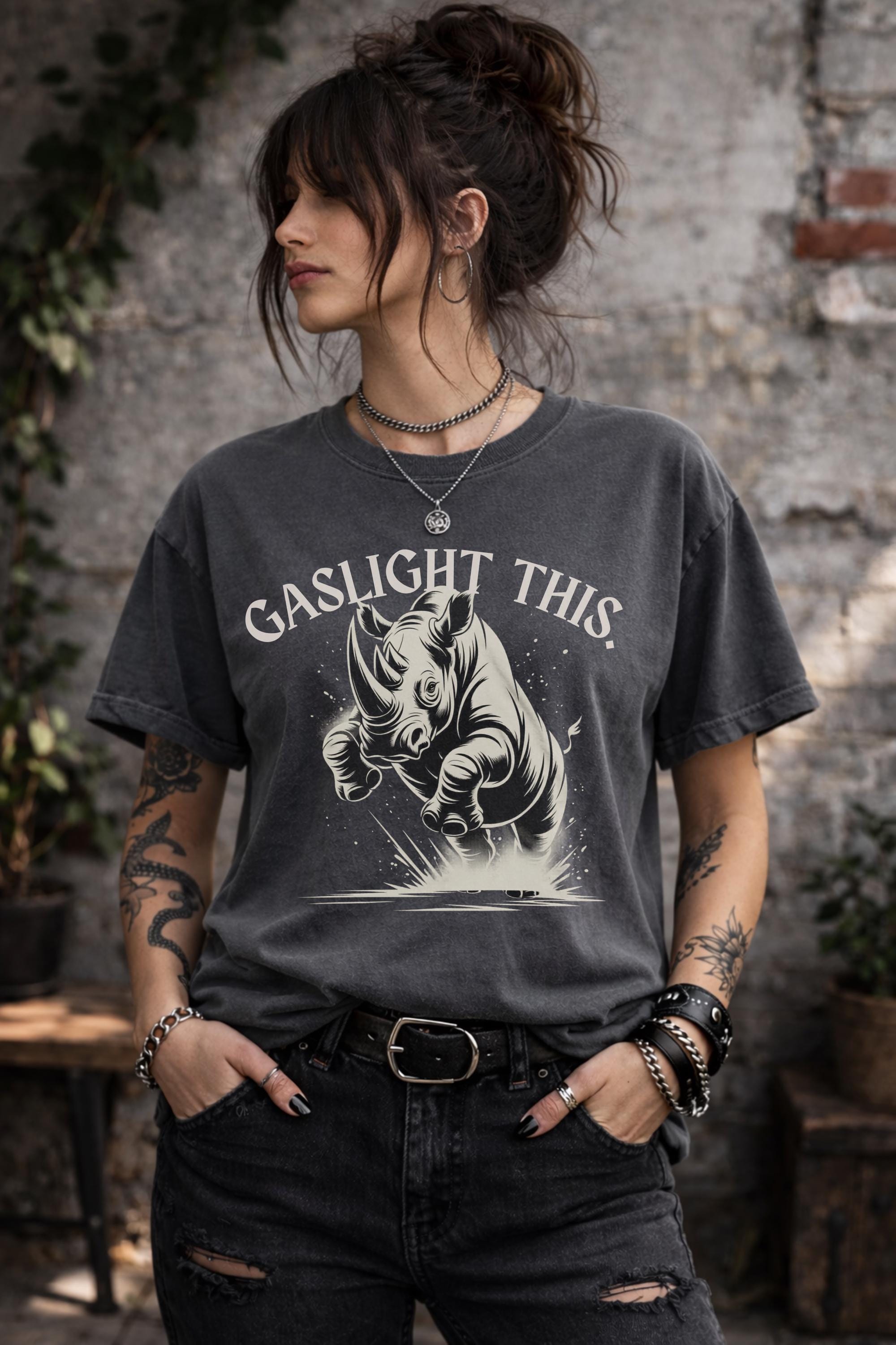 Edgy woman model in ripped jeans wearing funny gaslight this slogan shirt lifestyle mockup