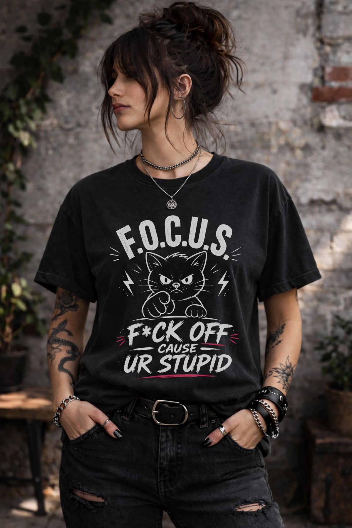 Woman wearing dark gray sarcastic cat graphic t-shirt with bold funny text outdoors