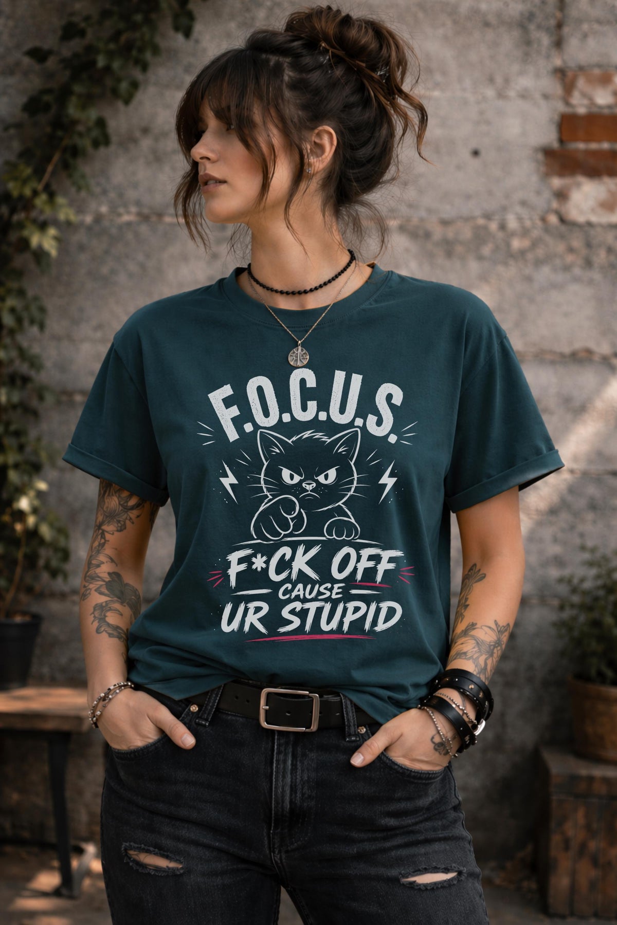 Woman wearing dark gray sarcastic cat graphic t-shirt with bold funny text outdoors