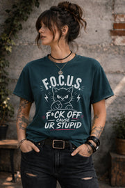 Woman wearing dark gray sarcastic cat graphic t-shirt with bold funny text outdoors