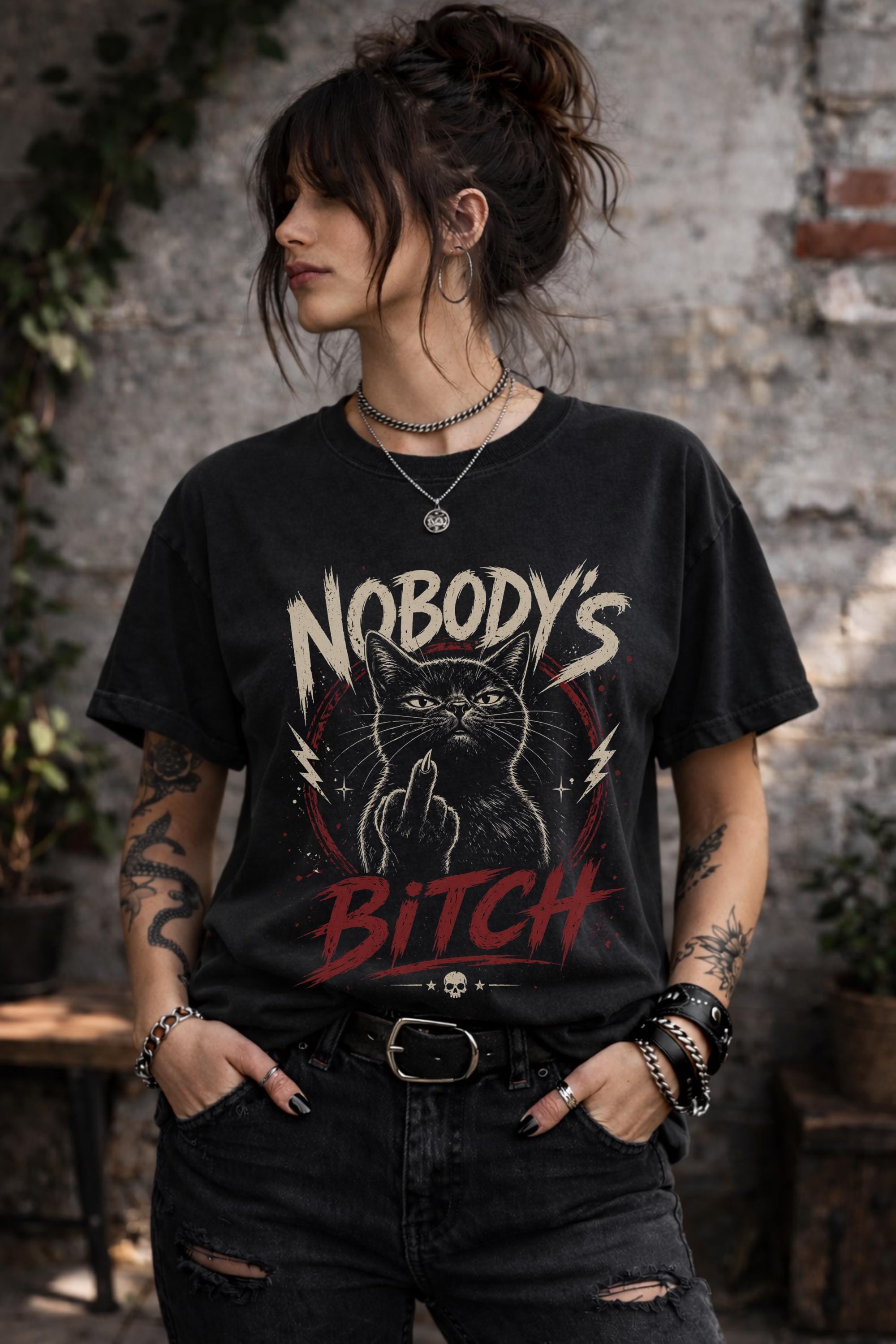 Close up of edgy cat illustration flipping off with bold text on dark shirt