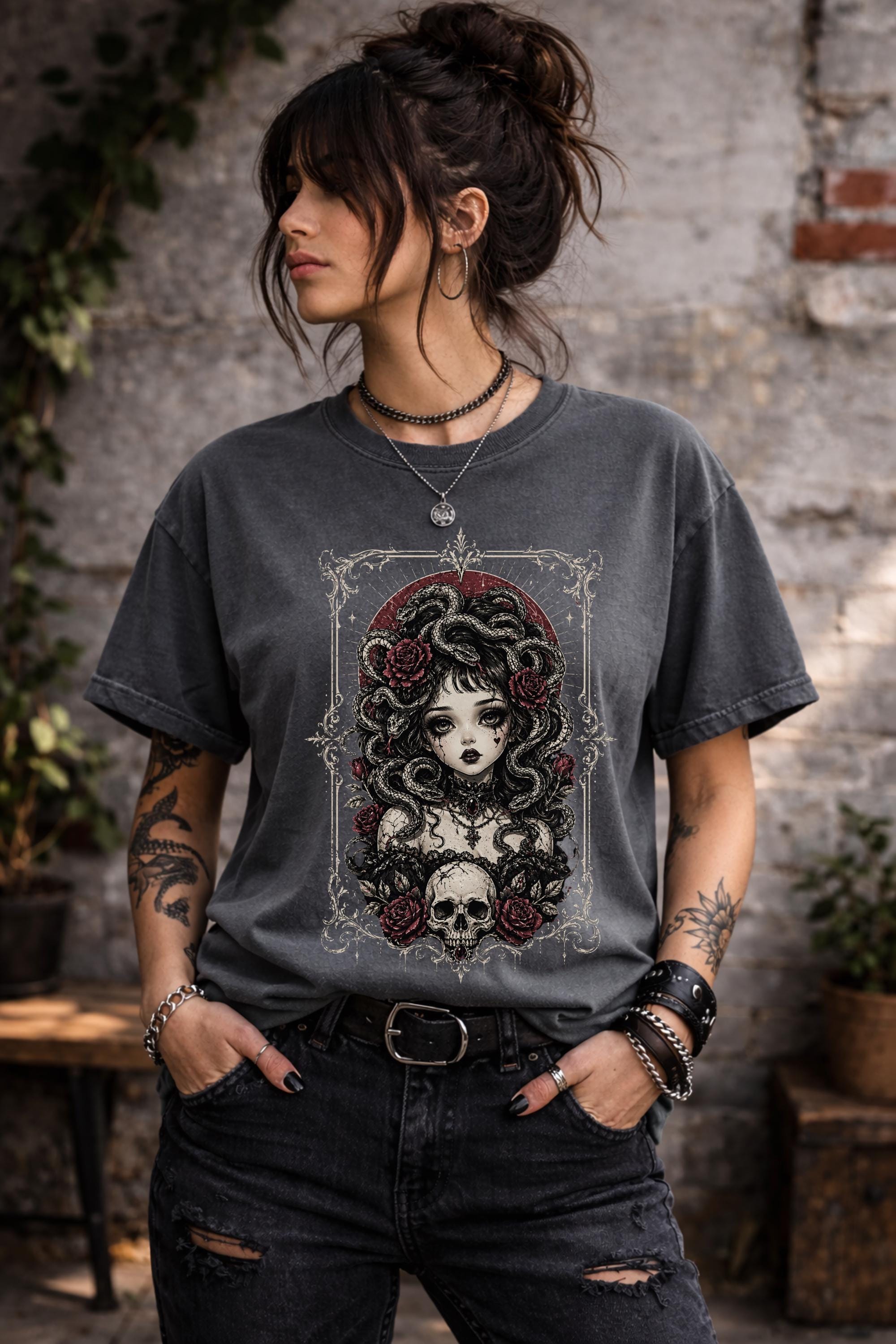 Woman wearing dark gray gothic medusa graphic t-shirt with snake hair and skull design