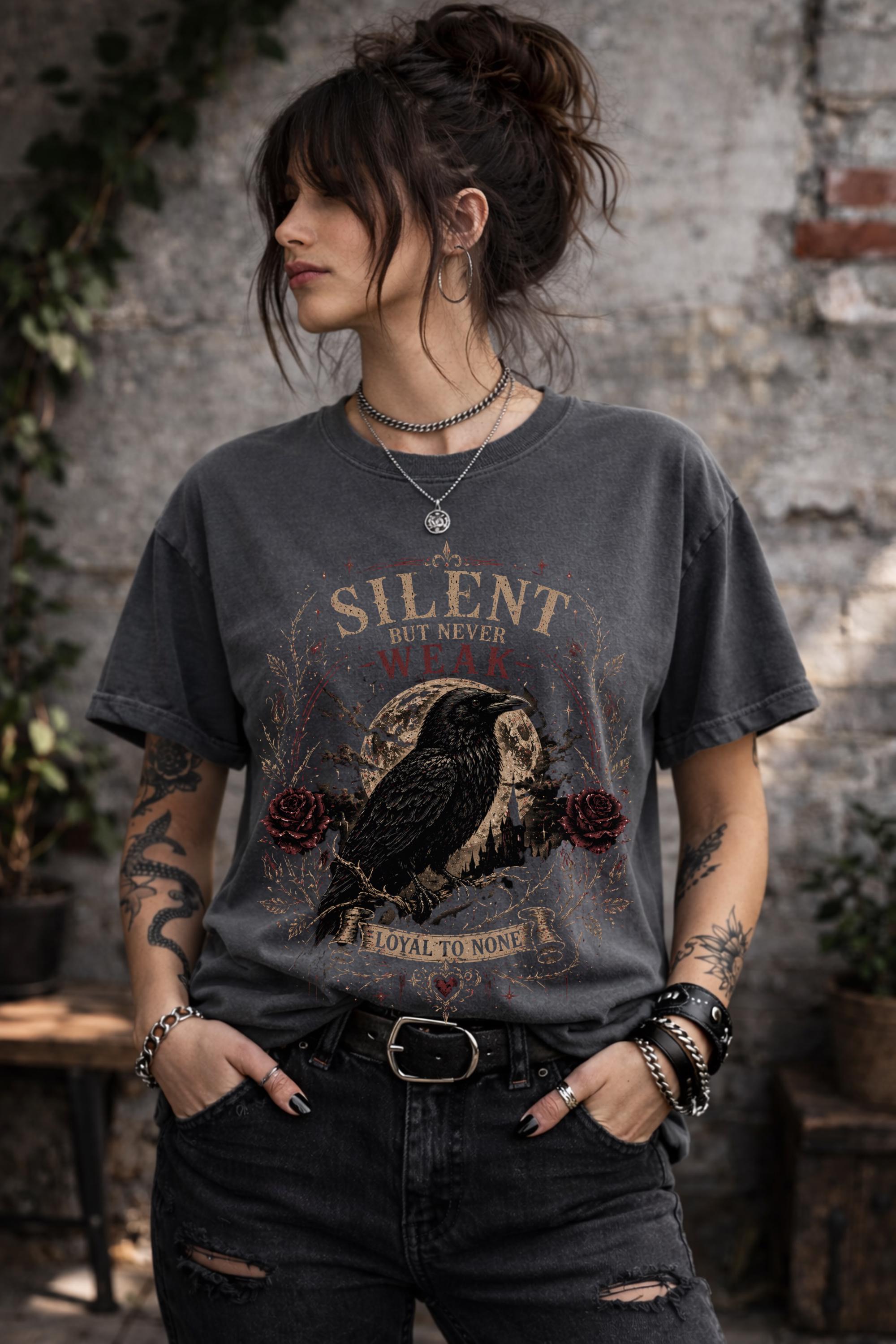 Woman wearing gothic raven shirt in moody outdoor setting, dark academia fashion with edgy alternative style