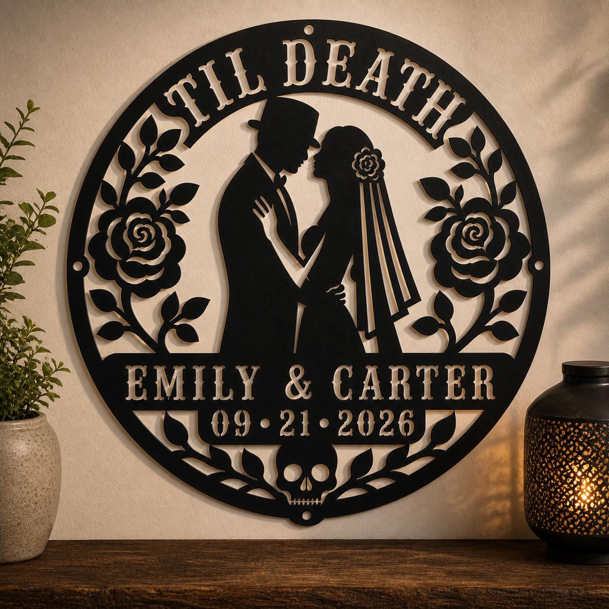 Gothic metal wall decor with til death couple design and custom names displayed above a rustic console with candles and skull accents