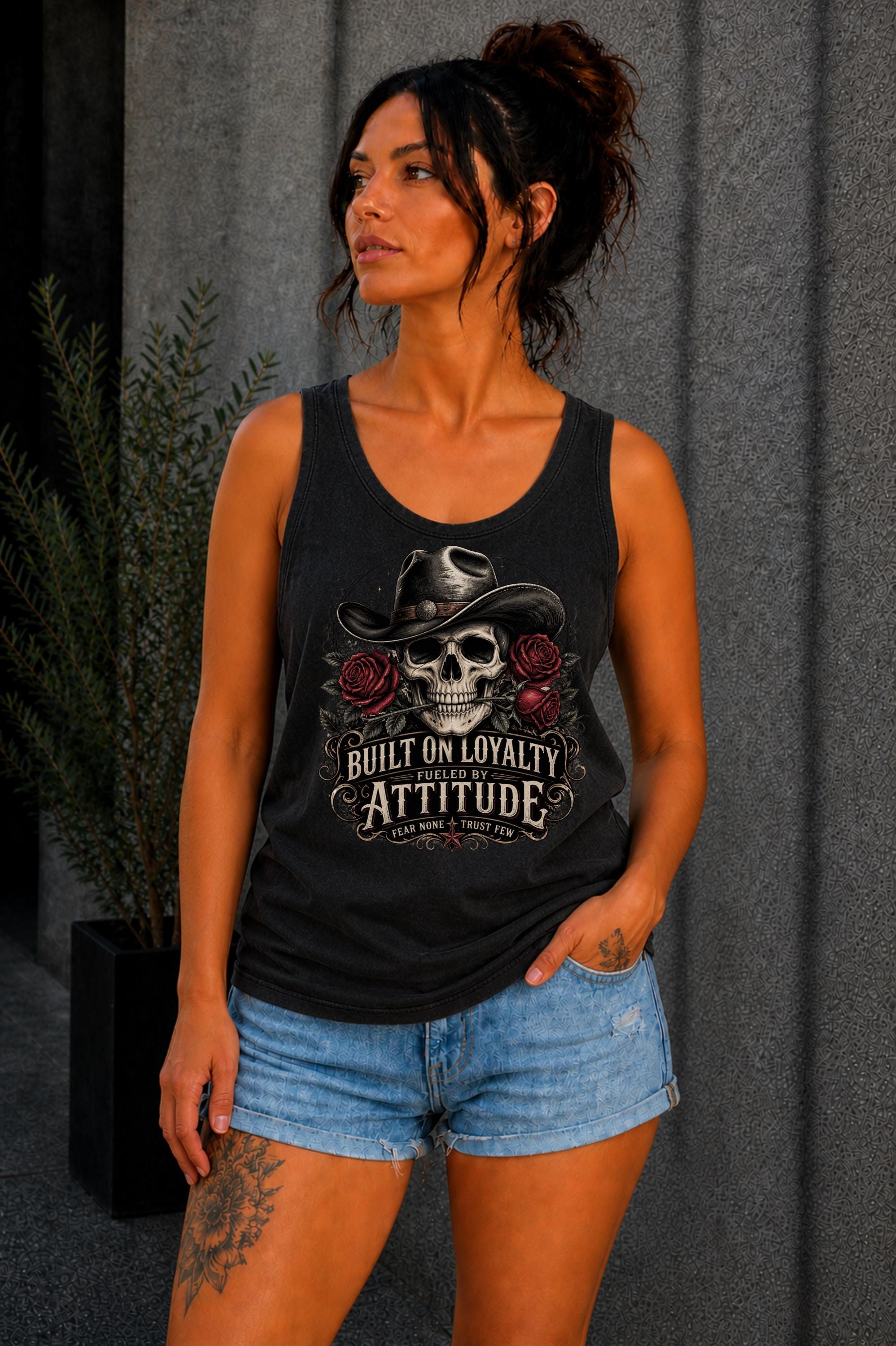 Tank-Top featuring cowboy skull with hat and red roses, Built on Loyalty Fueled by Attitude graphic, styled with edgy casual outfit