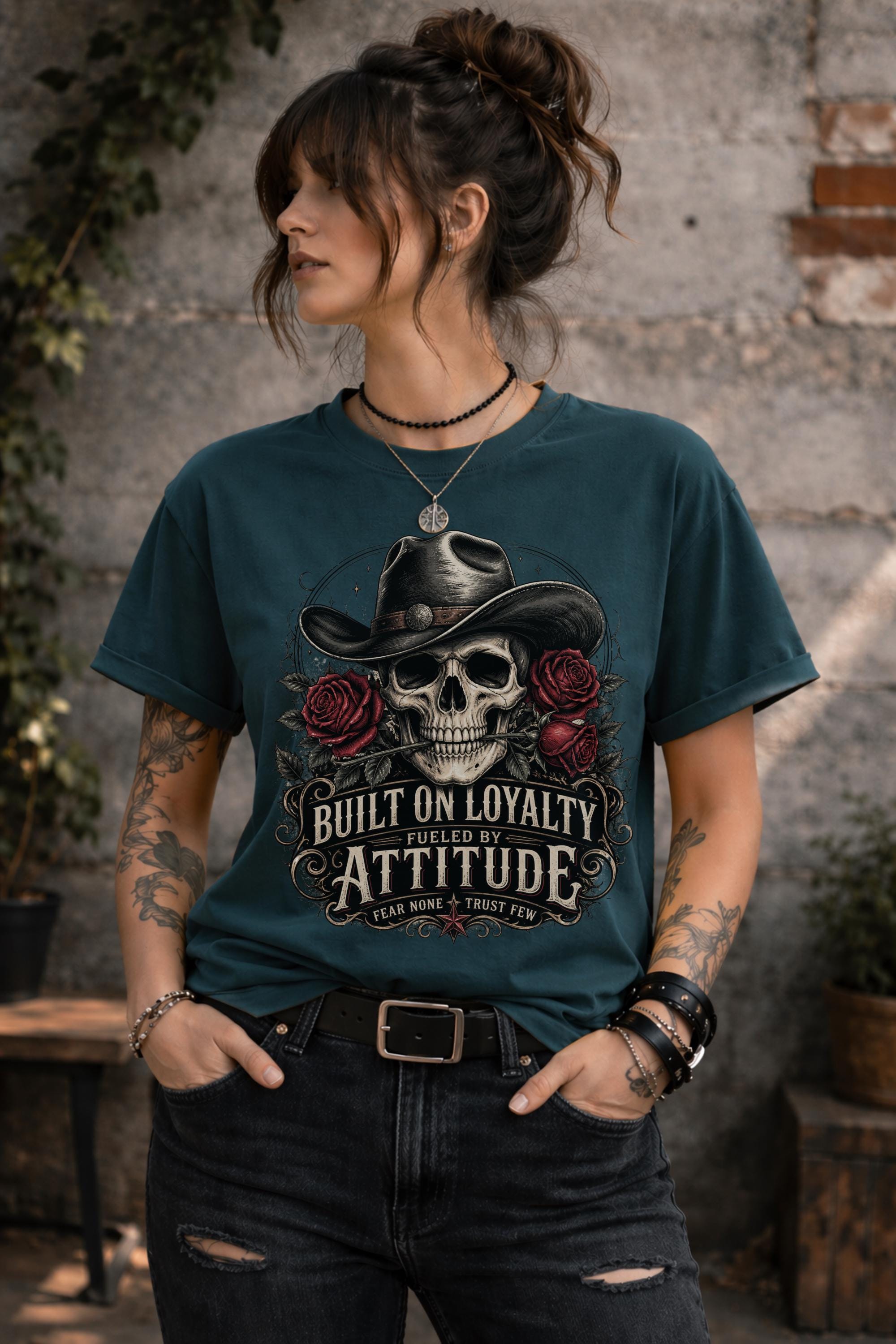 T-Shirt featuring cowboy skull with hat and red roses, Built on Loyalty Fueled by Attitude graphic, styled with edgy casual outfit