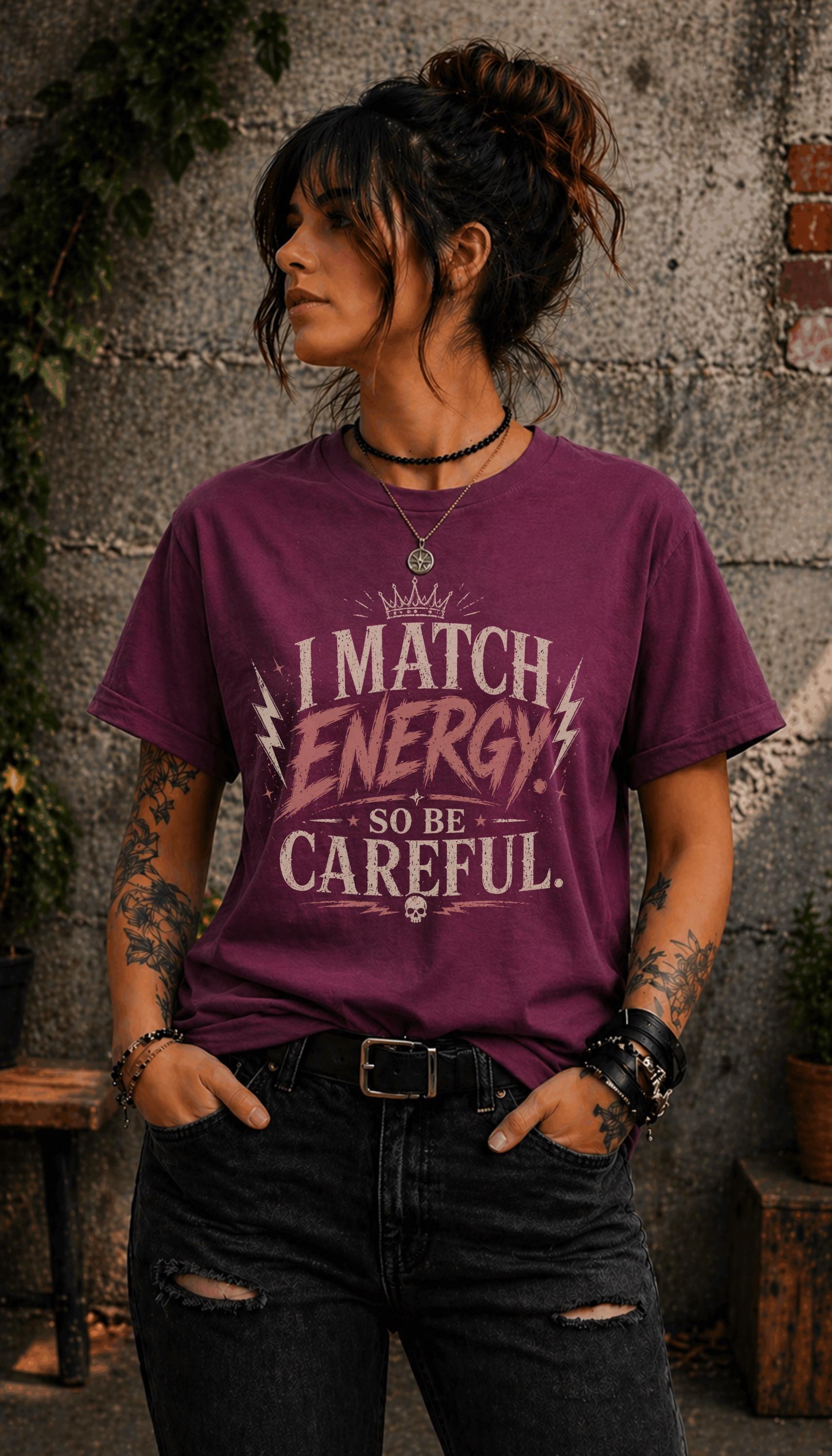 Woman wearing dark vintage wash graphic t-shirt featuring the phrase I Match Energy So Be Careful in distressed typography
