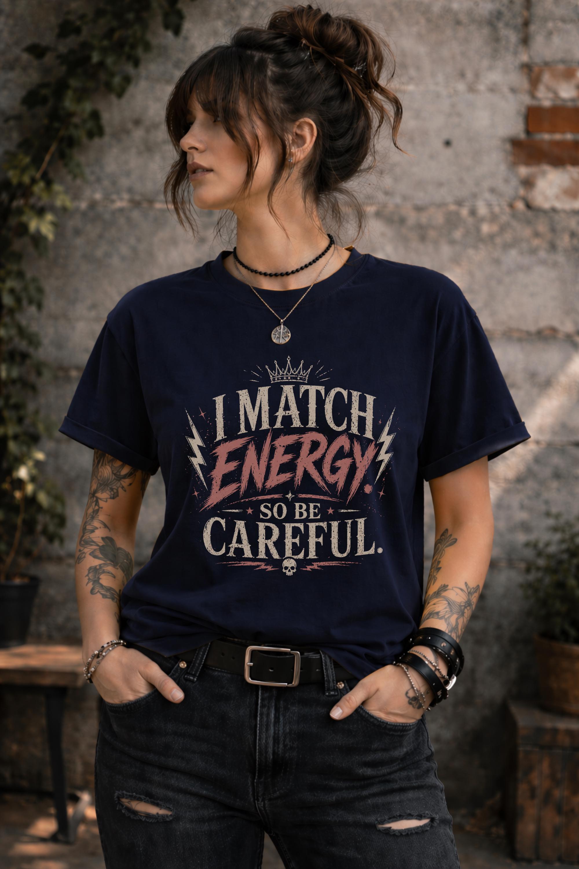 Woman wearing dark vintage wash graphic t-shirt featuring the phrase I Match Energy So Be Careful in distressed typography