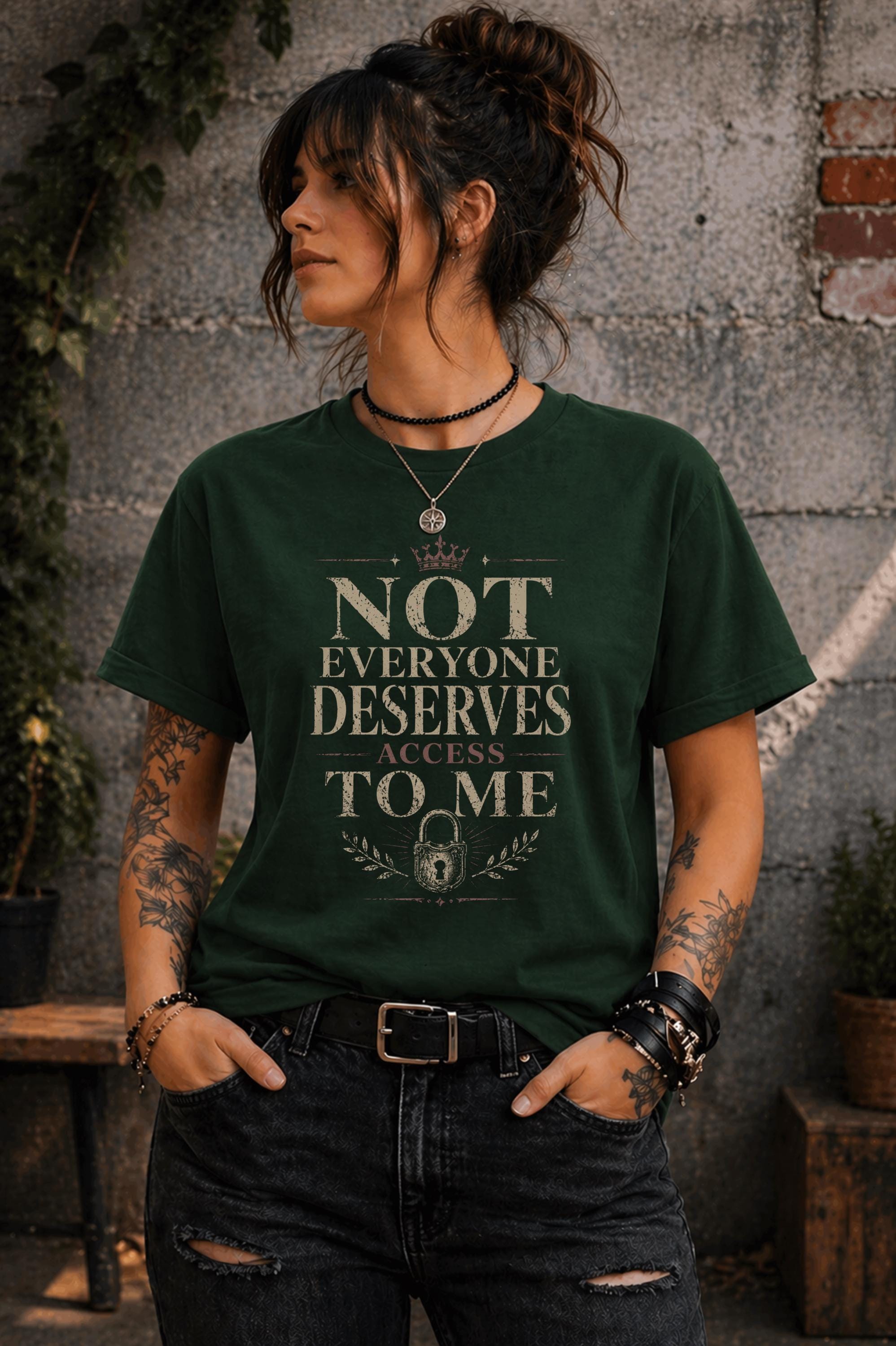 Woman wearing black graphic t-shirt with the phrase Not Everyone Deserves Access To Me in distressed vintage typography