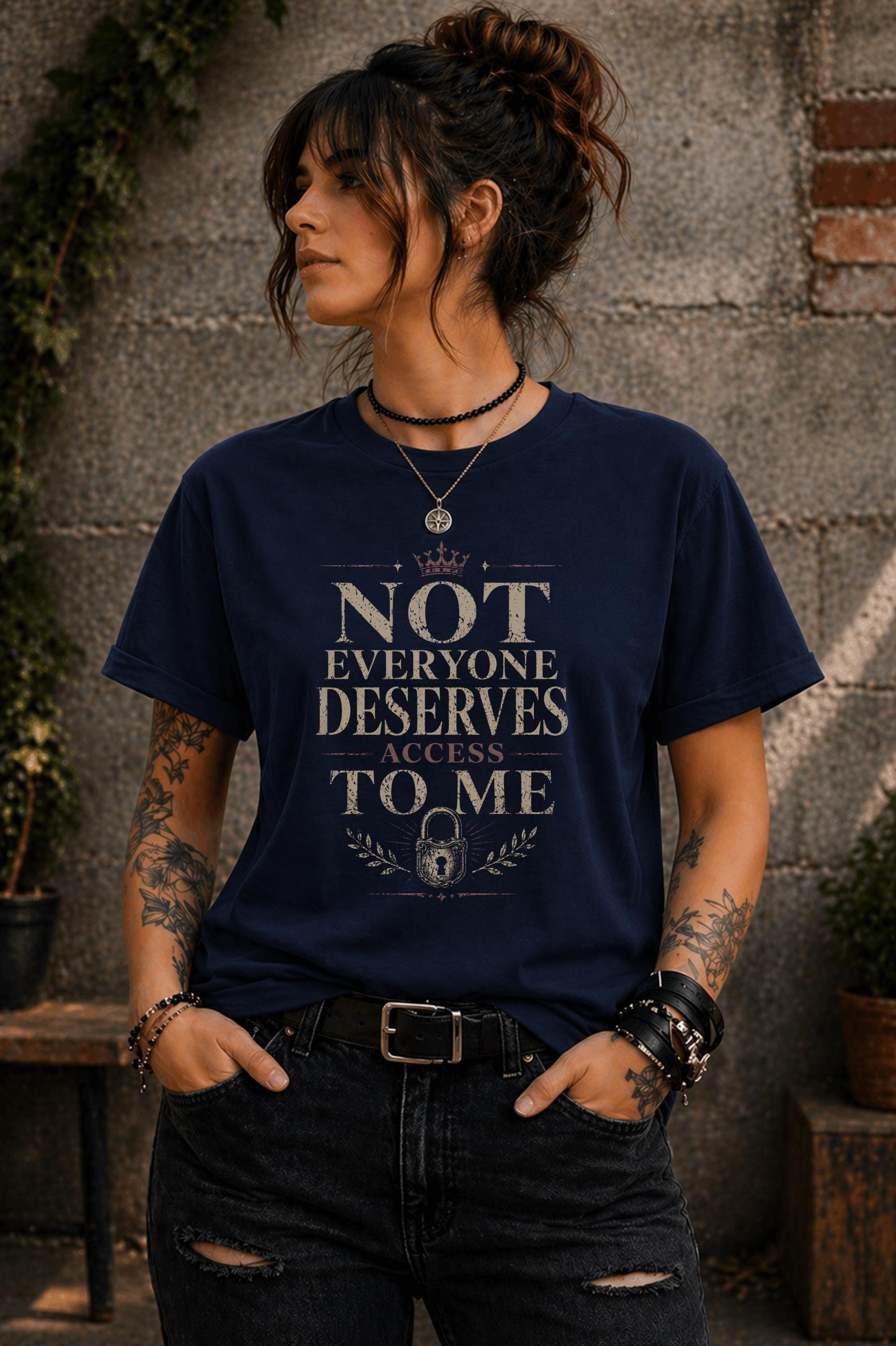 Woman wearing black graphic t-shirt with the phrase Not Everyone Deserves Access To Me in distressed vintage typography