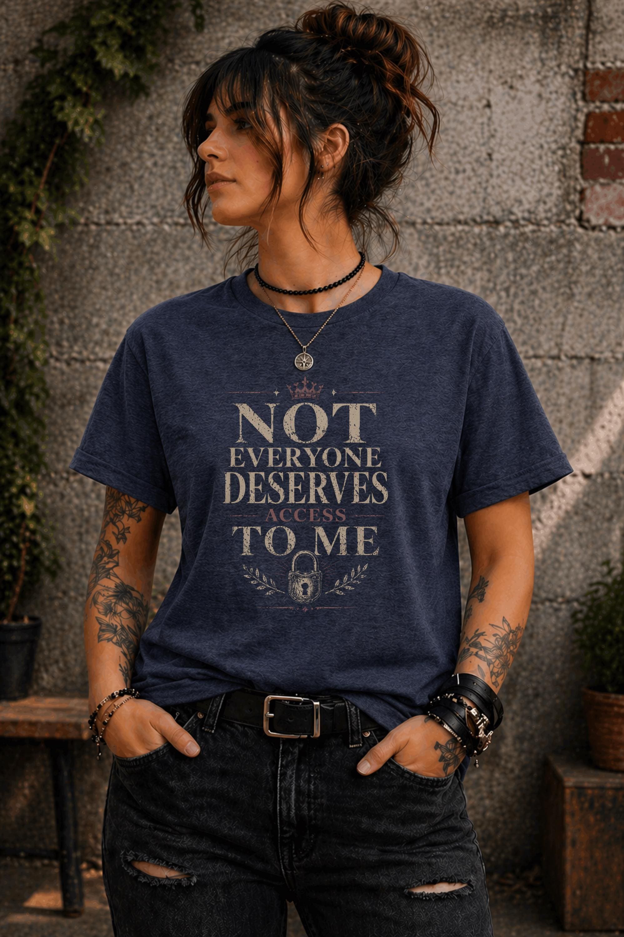 Woman wearing black graphic t-shirt with the phrase Not Everyone Deserves Access To Me in distressed vintage typography
