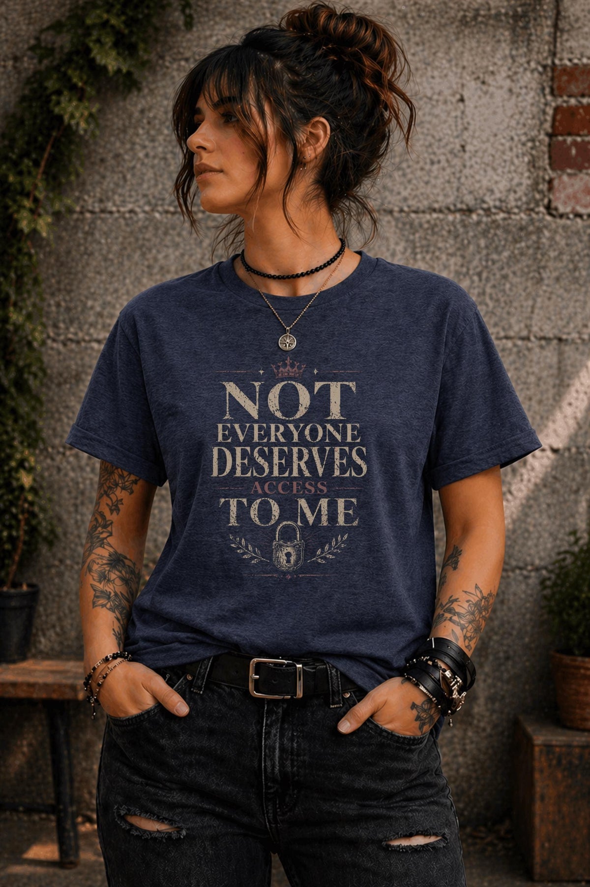 Woman wearing black graphic t-shirt with the phrase Not Everyone Deserves Access To Me in distressed vintage typography
