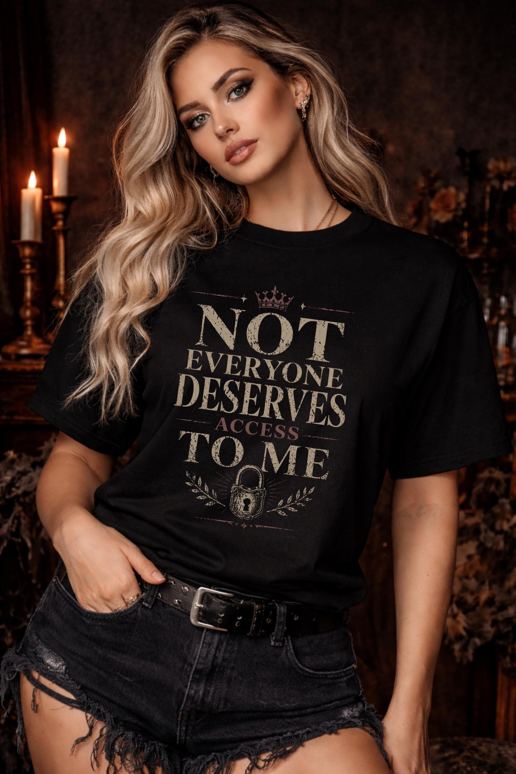 Blonde woman wearing black graphic t-shirt with the phrase Not Everyone Deserves Access To Me in distressed vintage typography
