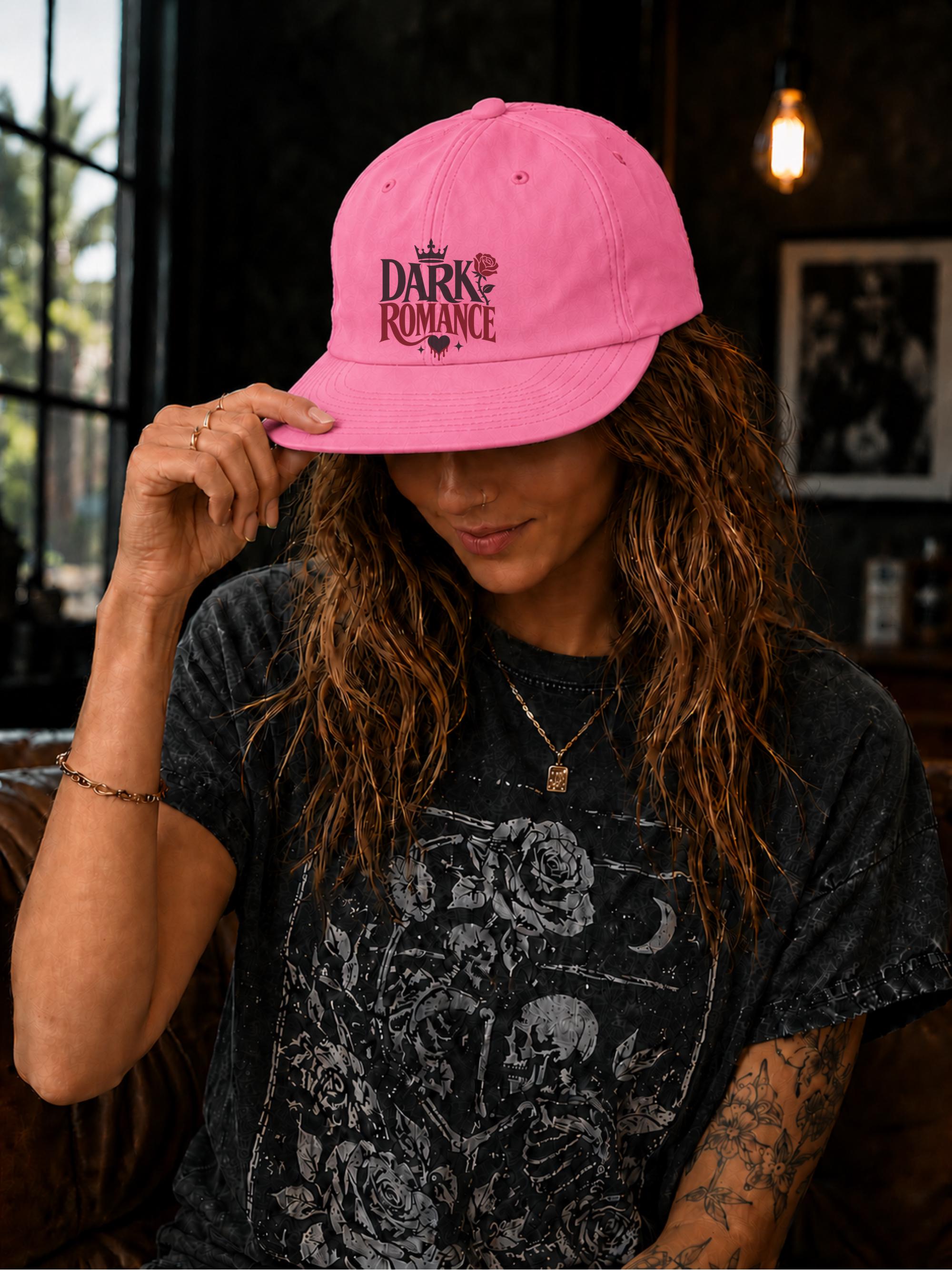 Woman wearing a surf cap featuring a Dark Romance graphic with red rose detail, photographed in a moody bookish setting with dark academia aesthetic.