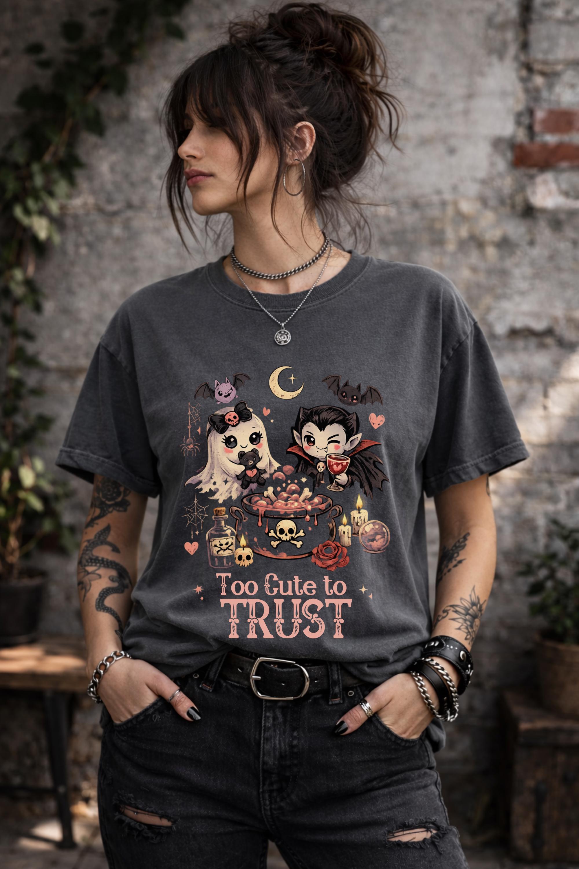 Whimsical spooky apparel featuring kawaii ghost and vampire characters with dark fantasy illustrations and pastel gothic colors.