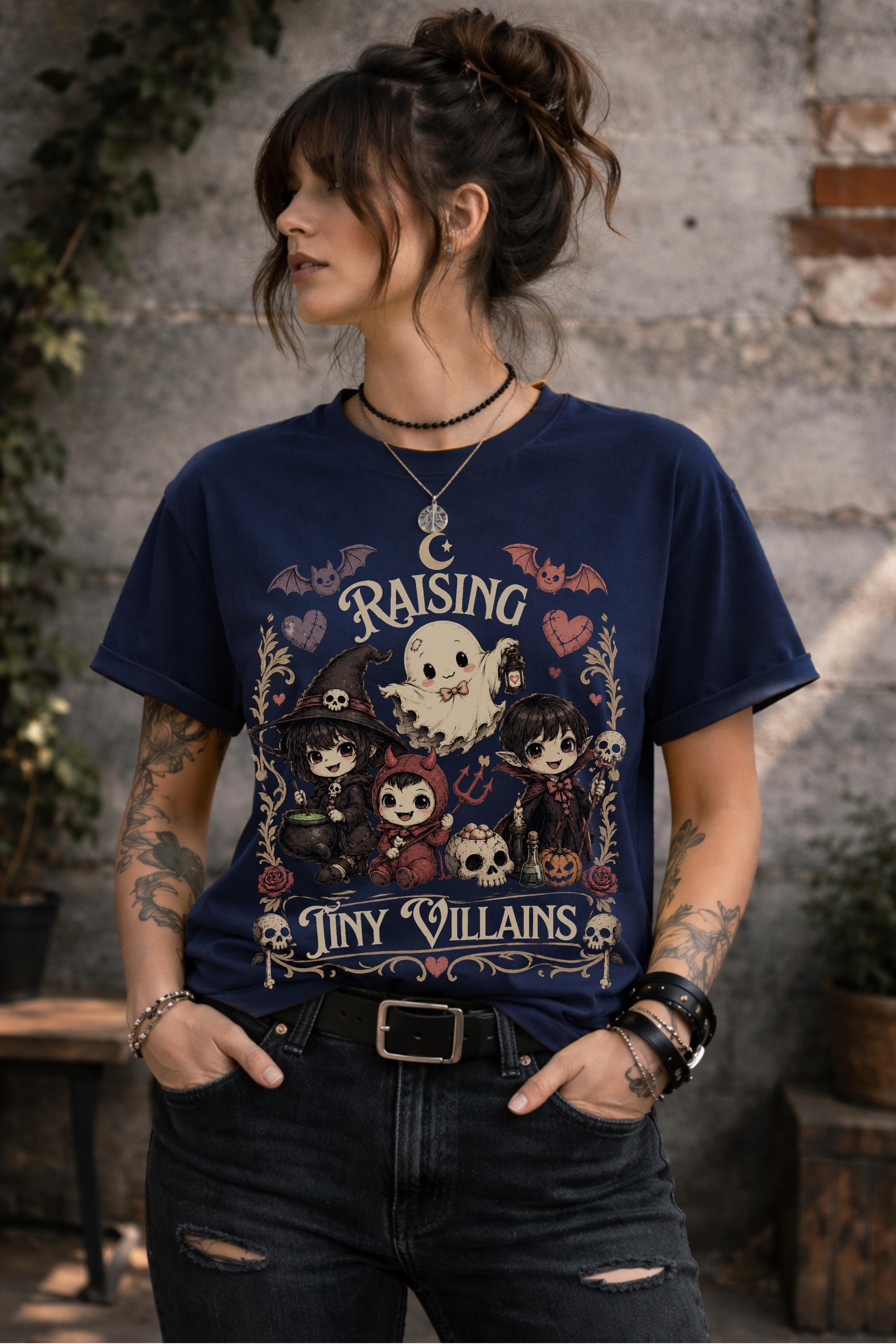 Alternative aesthetic graphic shirt featuring charming little monsters, ghost character, skull decorations, and gothic cottagecore vibes.