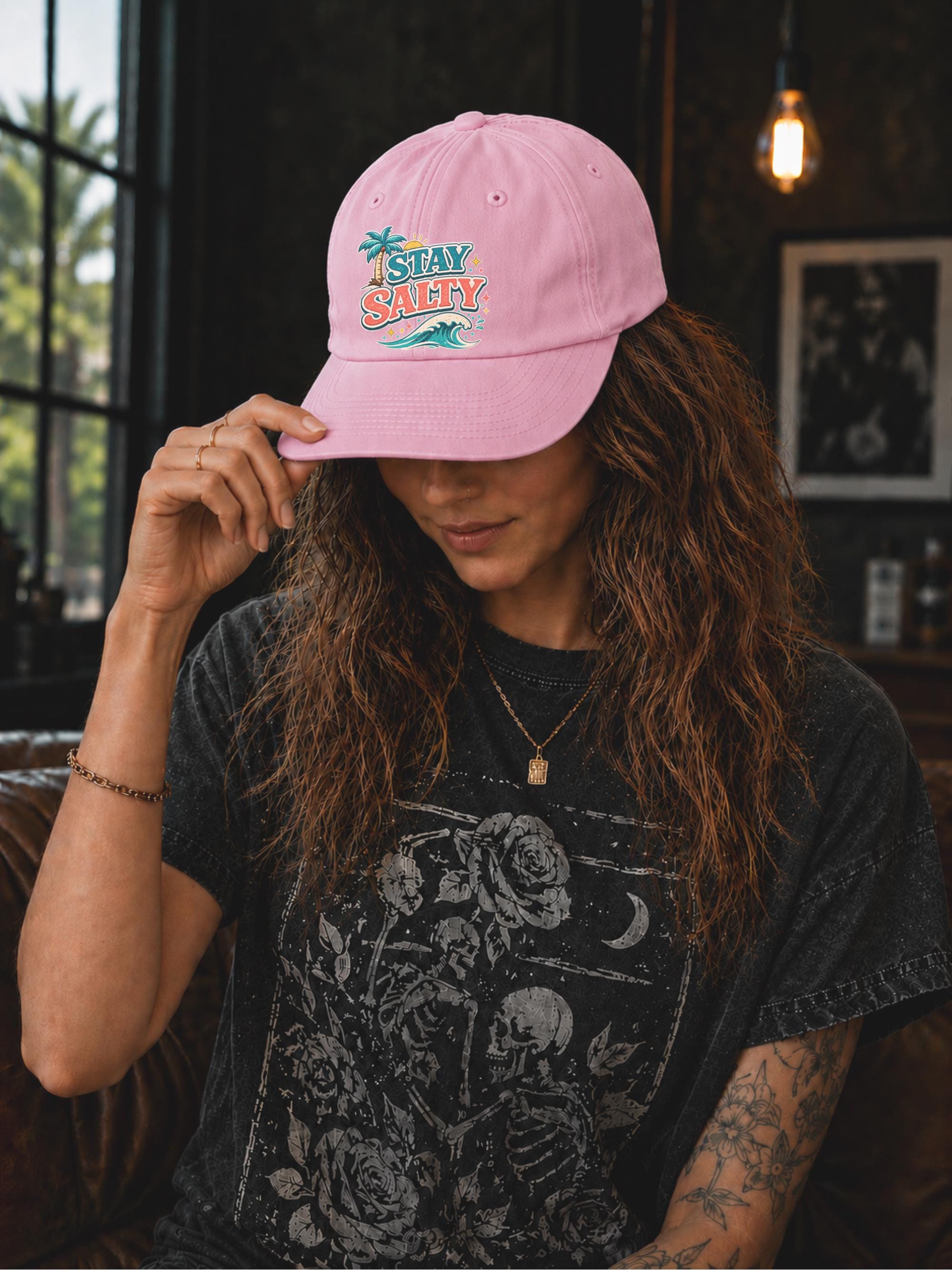 Beach lifestyle dad cap featuring palm trees, waves, and retro Stay Salty artwork