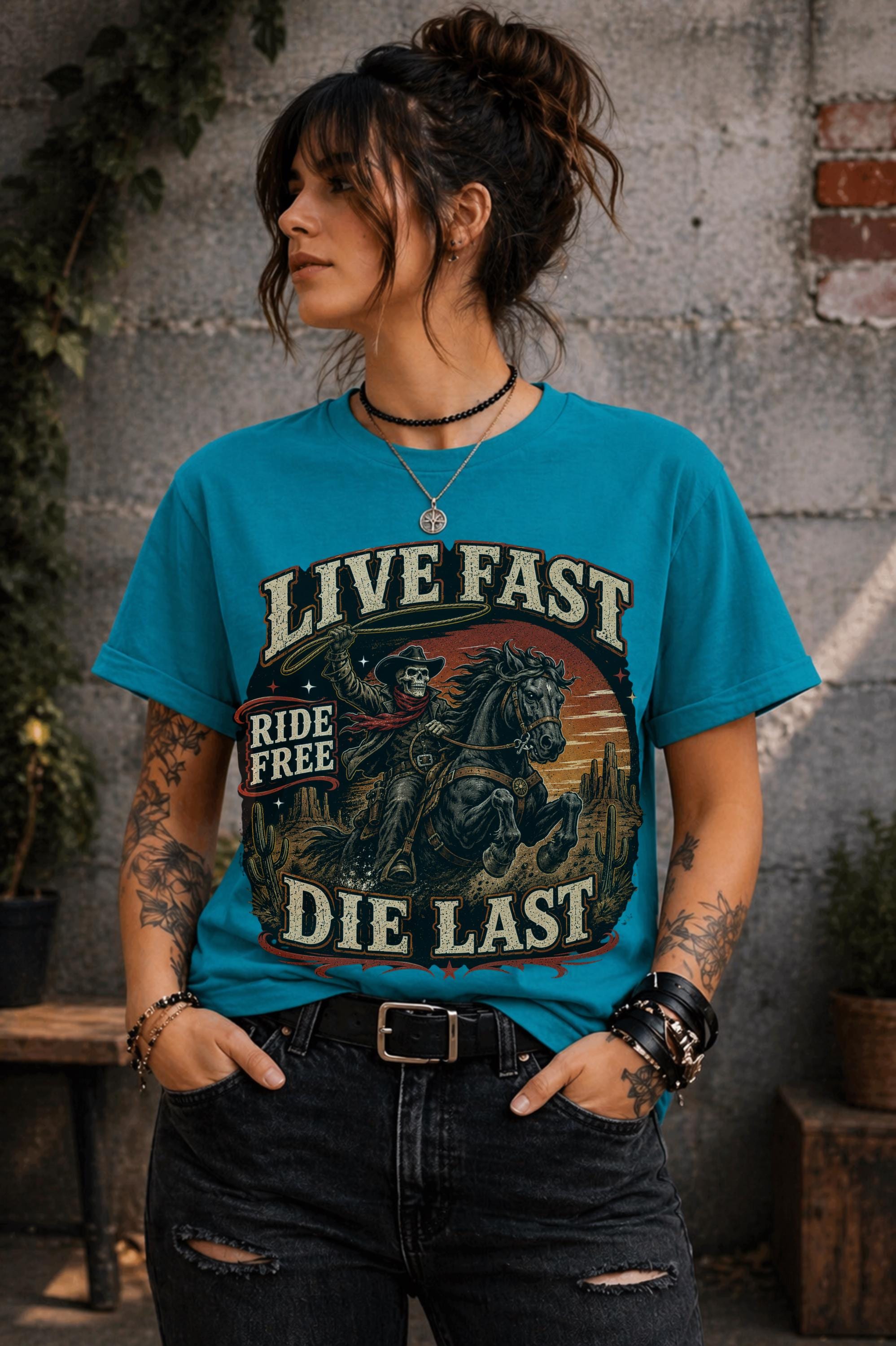 live fast die last shirt, skeleton cowboy tee, western rider shirt, outlaw graphic tee, cowboy skull design, rodeo apparel, country music shirt, horse lover gift, western fashion top, desert sunset graphic, ranch lifestyle tee, vintage outlaw shirt, comfort colors western tee