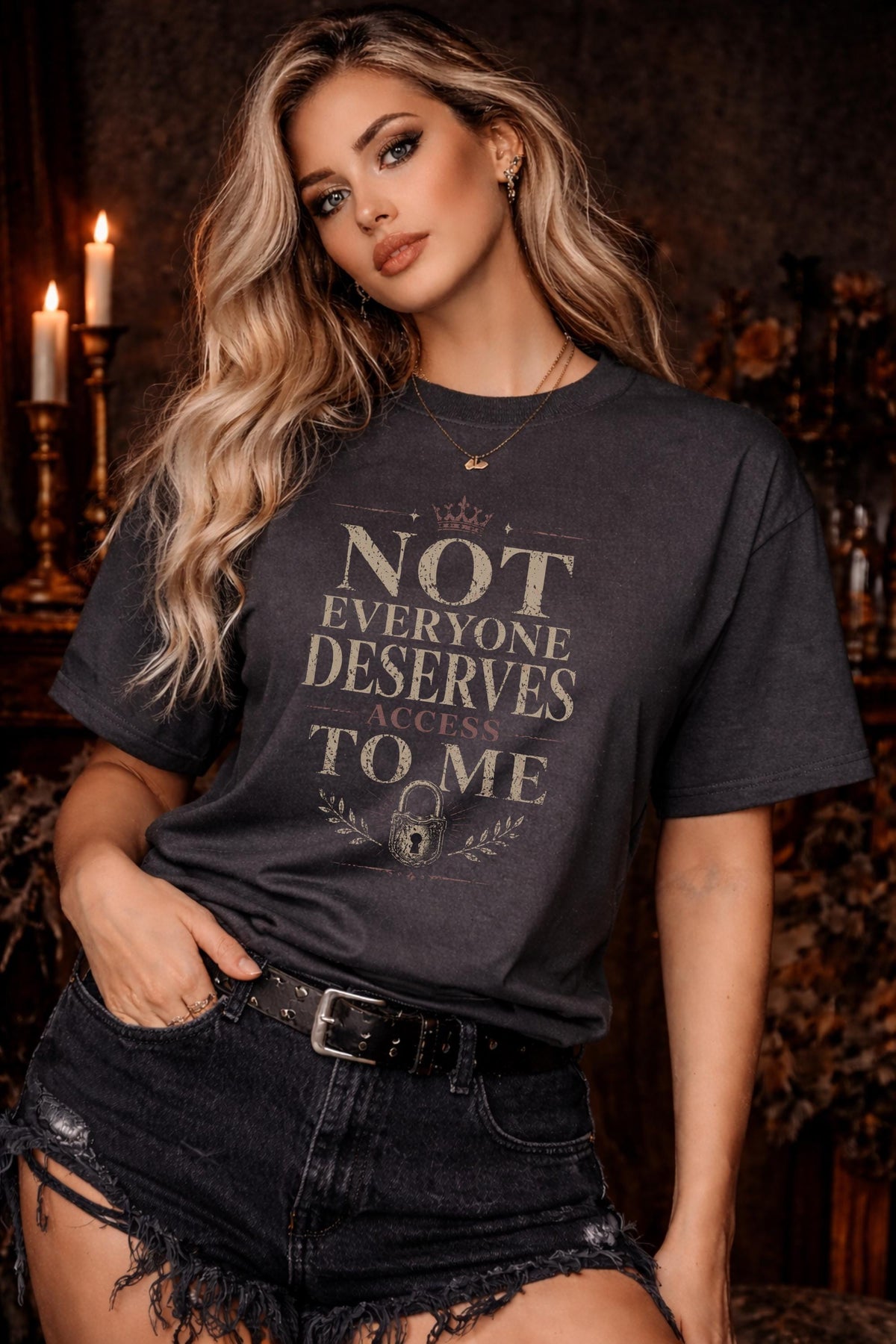 Woman wearing black graphic t-shirt with the phrase Not Everyone Deserves Access To Me in distressed vintage typography
