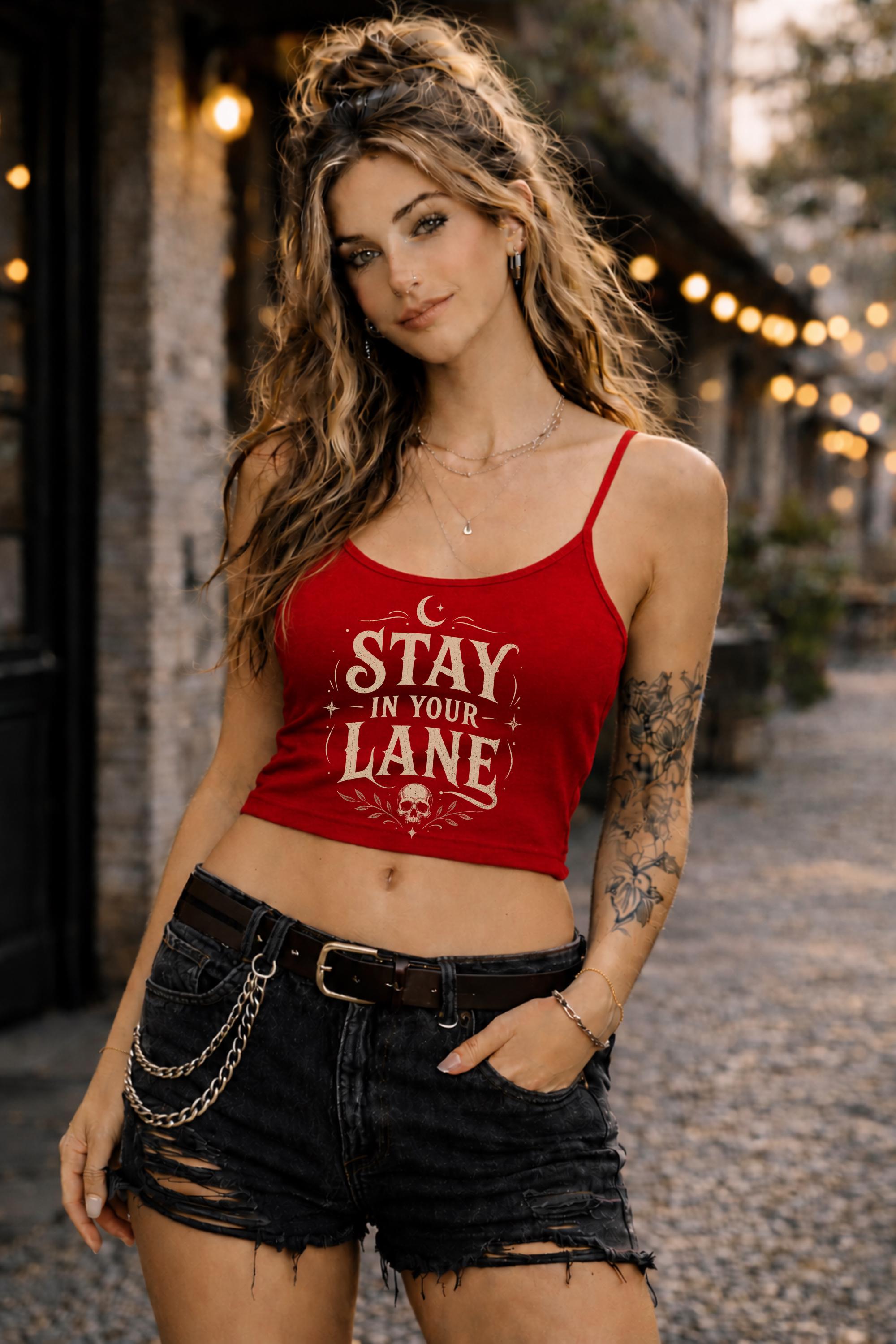 Woman wearing fitted black Stay In Your Lane graphic camisole tank with distressed gothic statement print