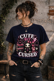 Cute But Cursed gothic kawaii graphic shirt featuring spooky character holding coffee mug