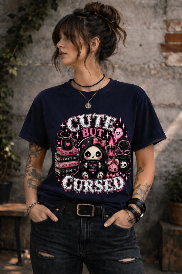 Cute But Cursed gothic kawaii graphic shirt featuring spooky character holding coffee mug