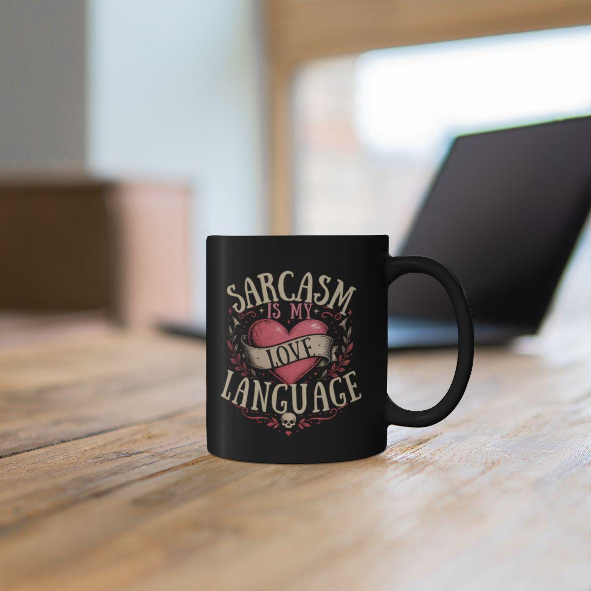 Black ceramic mug with sarcasm is my love language gothic heart design on rustic moody background with candle decor