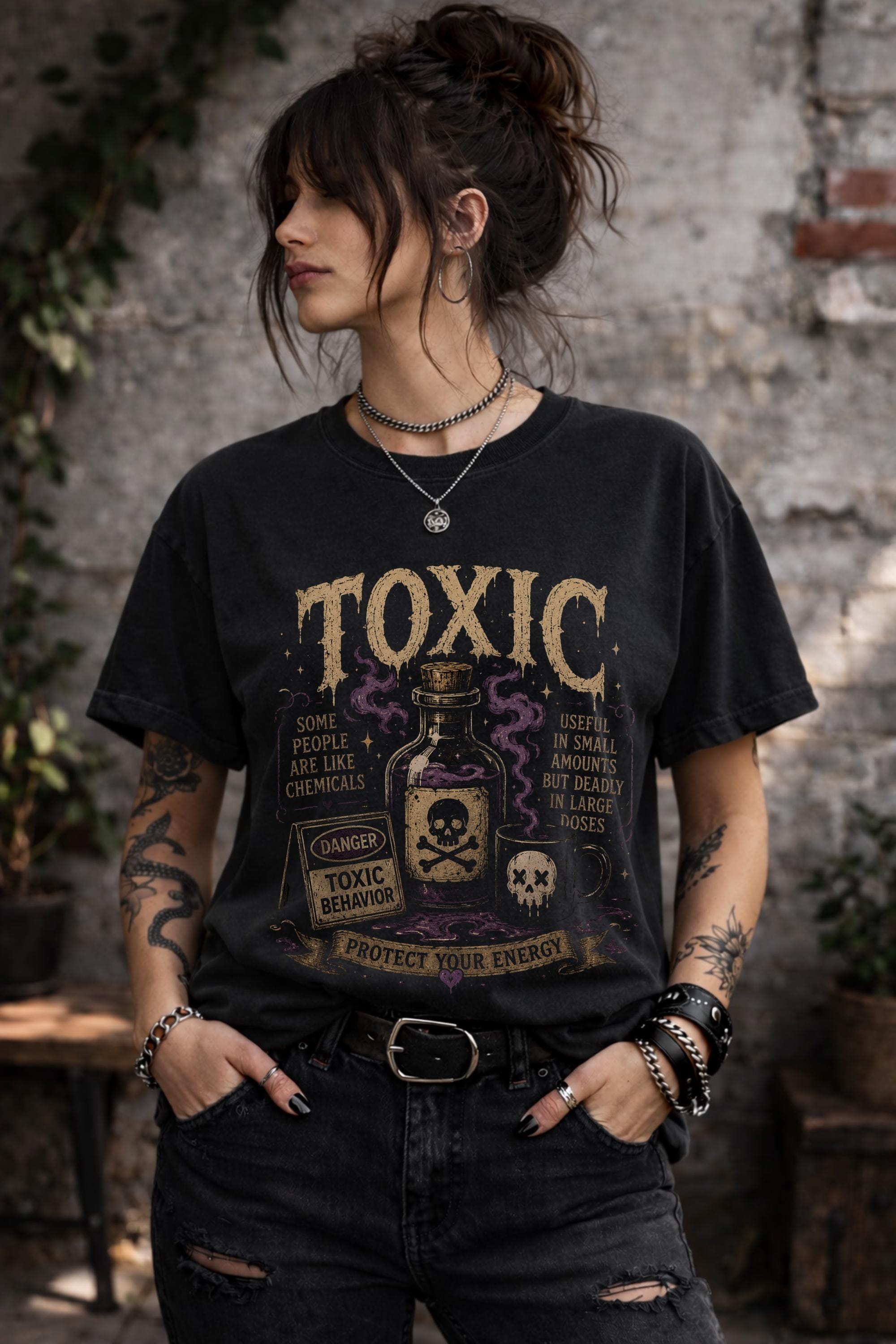 Woman wearing black gothic toxic people shirt with vintage poison bottle graphic and protect your energy quote