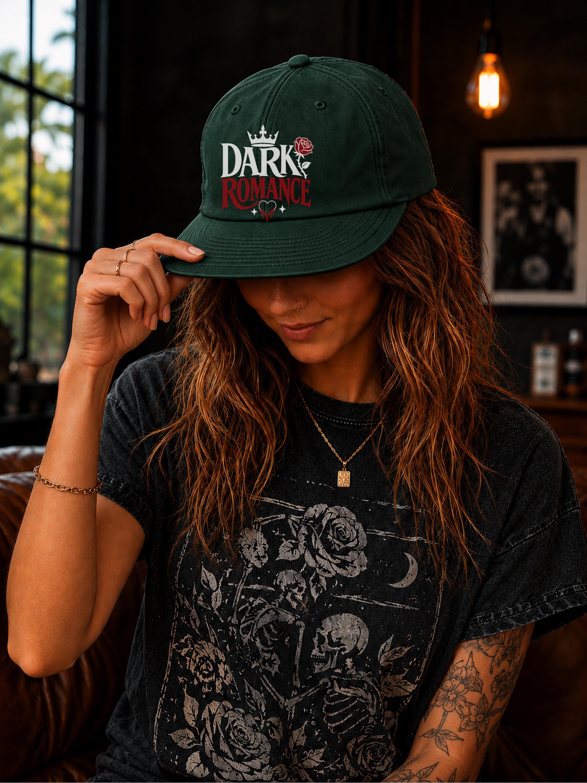 Woman wearing a surf cap featuring a Dark Romance graphic with red rose detail, photographed in a moody bookish setting with dark academia aesthetic.