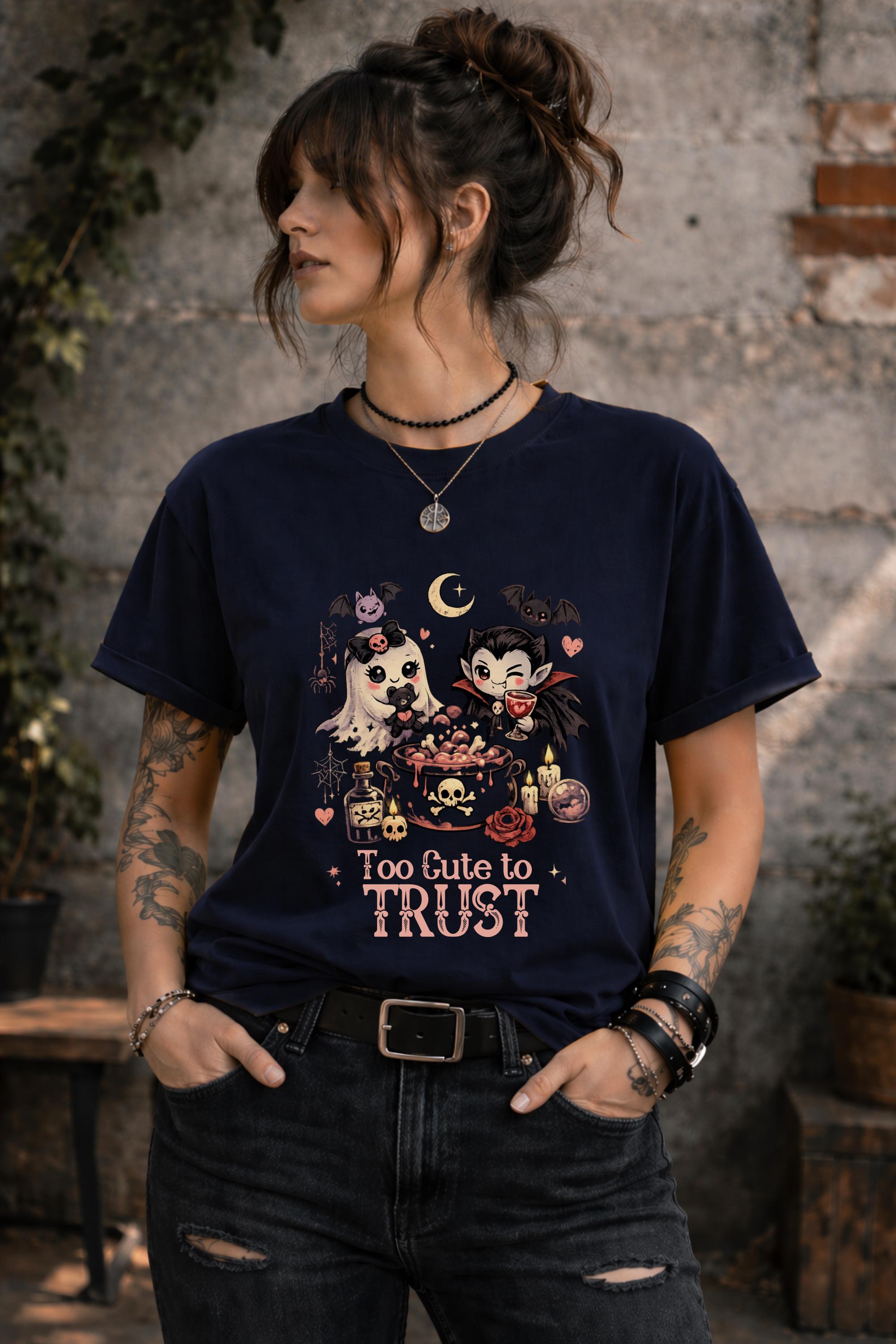 Cute creepy shirt with cartoon vampire and ghost gathered around a magical potion bowl surrounded by spooky decorative details.