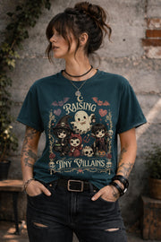 Gothic Halloween shirt with adorable cartoon ghost and tiny villains surrounded by skulls, roses, bats, and whimsical spooky details.