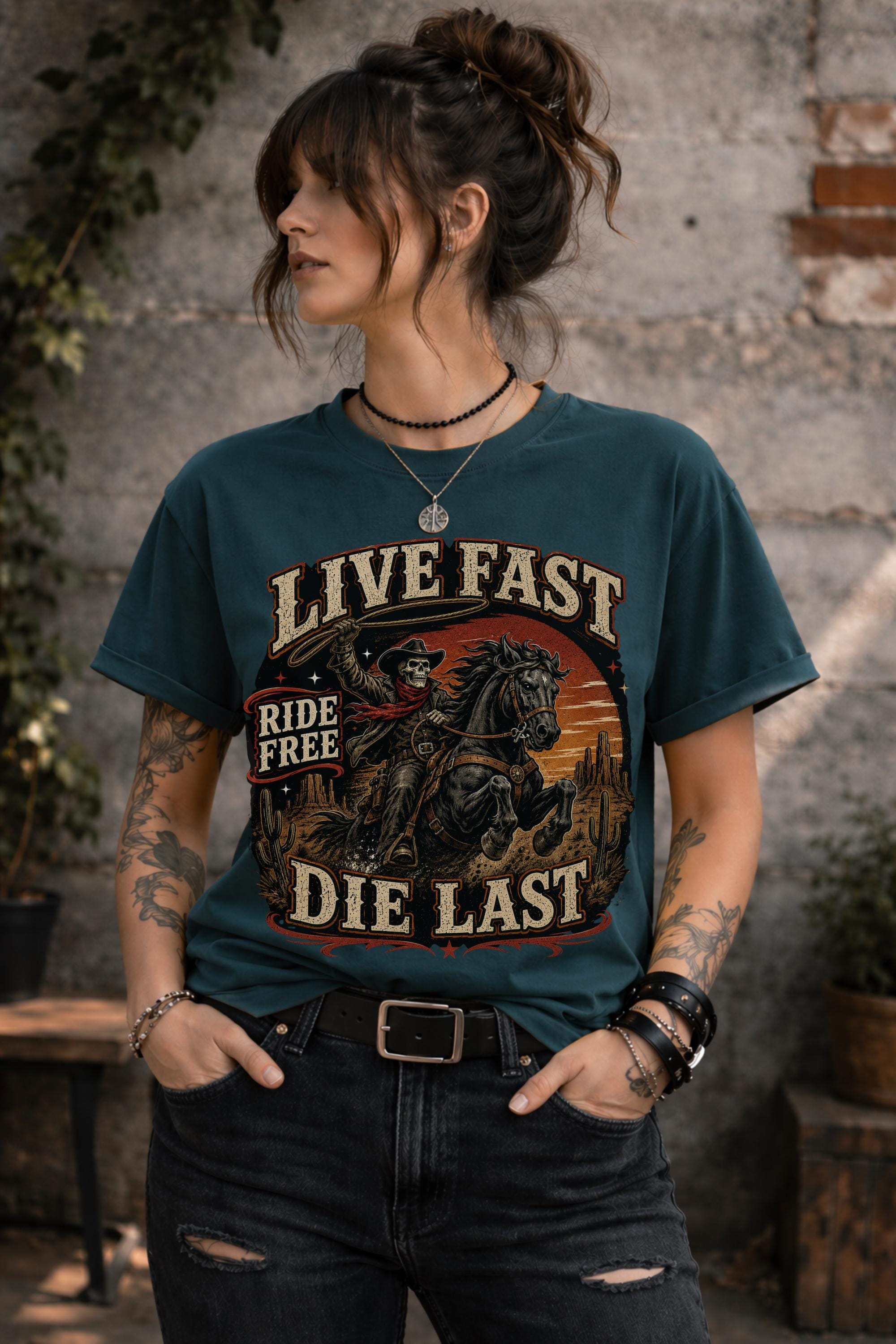 live fast die last shirt, skeleton cowboy tee, western rider shirt, outlaw graphic tee, cowboy skull design, rodeo apparel, country music shirt, horse lover gift, western fashion top, desert sunset graphic, ranch lifestyle tee, vintage outlaw shirt, comfort colors western tee