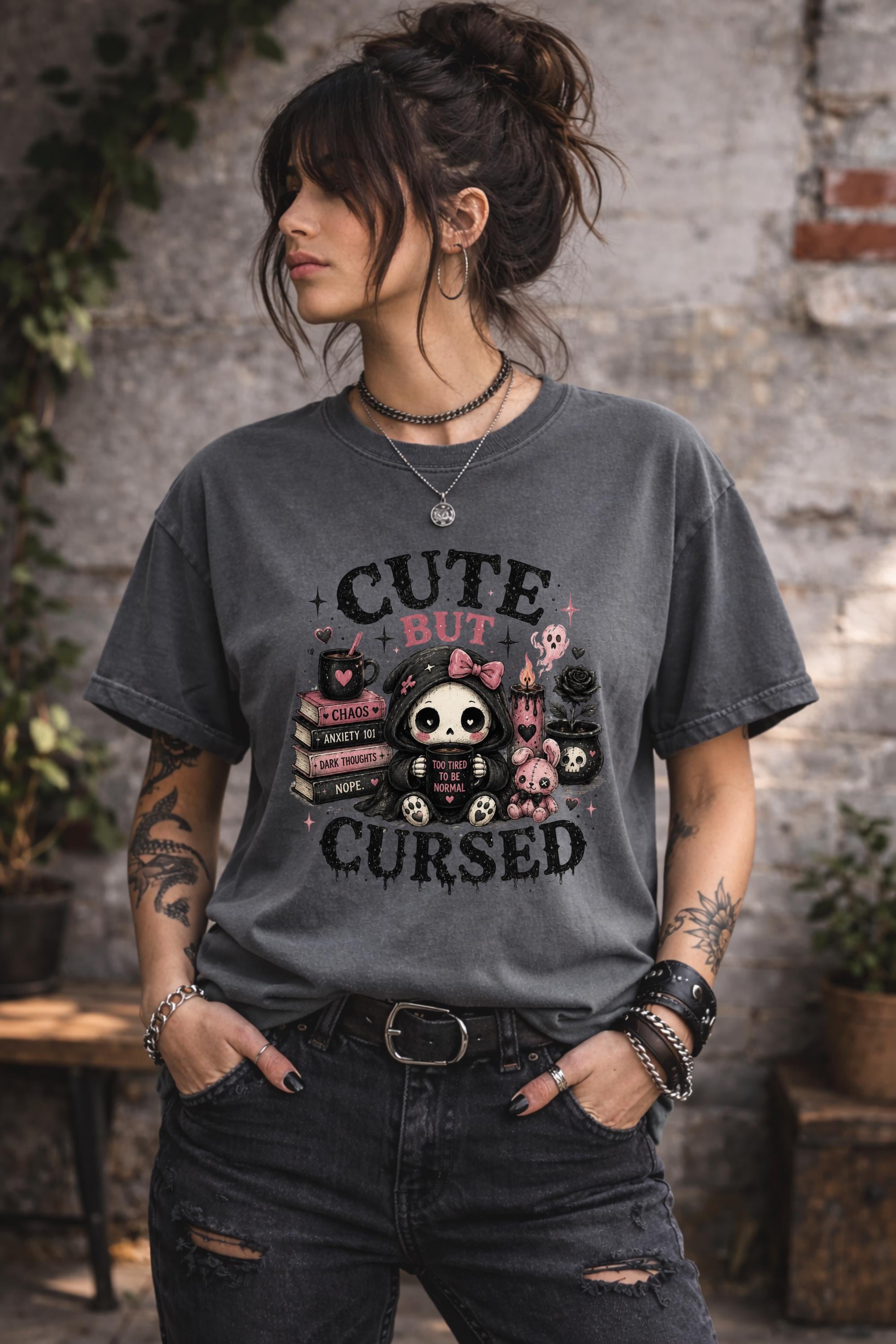 Spooky cute shirt with adorable gothic character surrounded by books candles and skulls