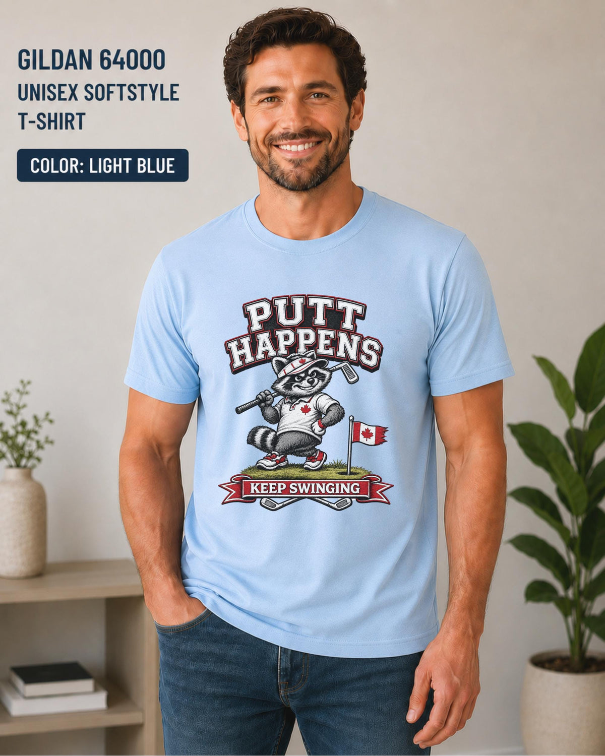 Light Blue Gildan 64000 golf t-shirt featuring a funny raccoon golfer with Putt Happens Keep Swinging design and Canadian flag accent