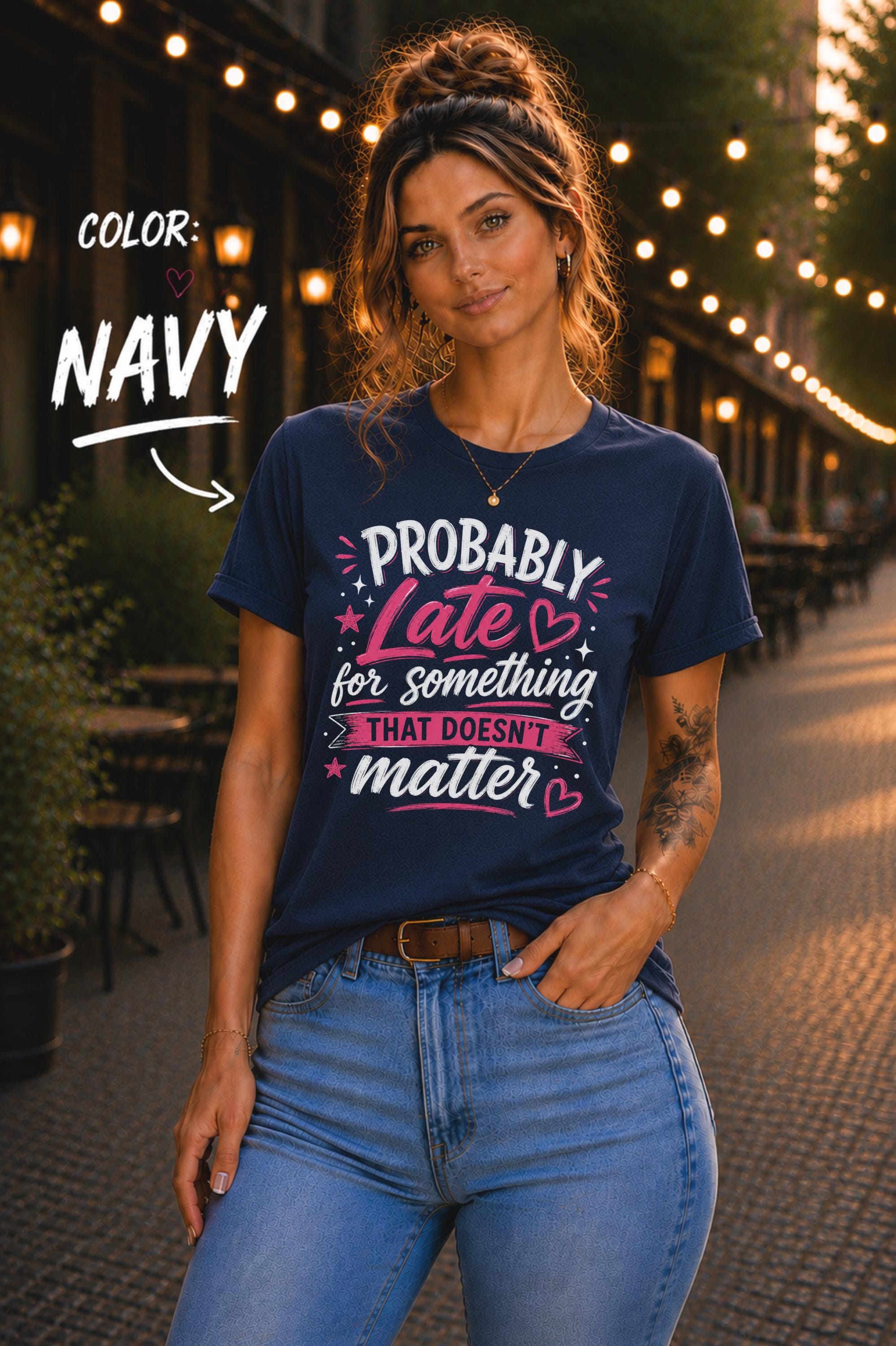 Woman wearing navy graphic t-shirt featuring the phrase "Probably Late for Something That Doesn't Matter" in pink and white typography with playful heart accents.