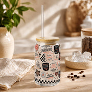 Glass can drinkware featuring checkerboard accents and smiley faces