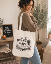 Bookish tote bag featuring open book illustration and Just One More Chapter quote