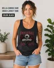 Woman wearing a black Bella+Canvas 3480 jersey tank featuring a gothic "Pickleball Mahjong Repeat" design with burgundy roses, distressed lettering, crossed paddles, and a heart-detail pickleball on a black background.