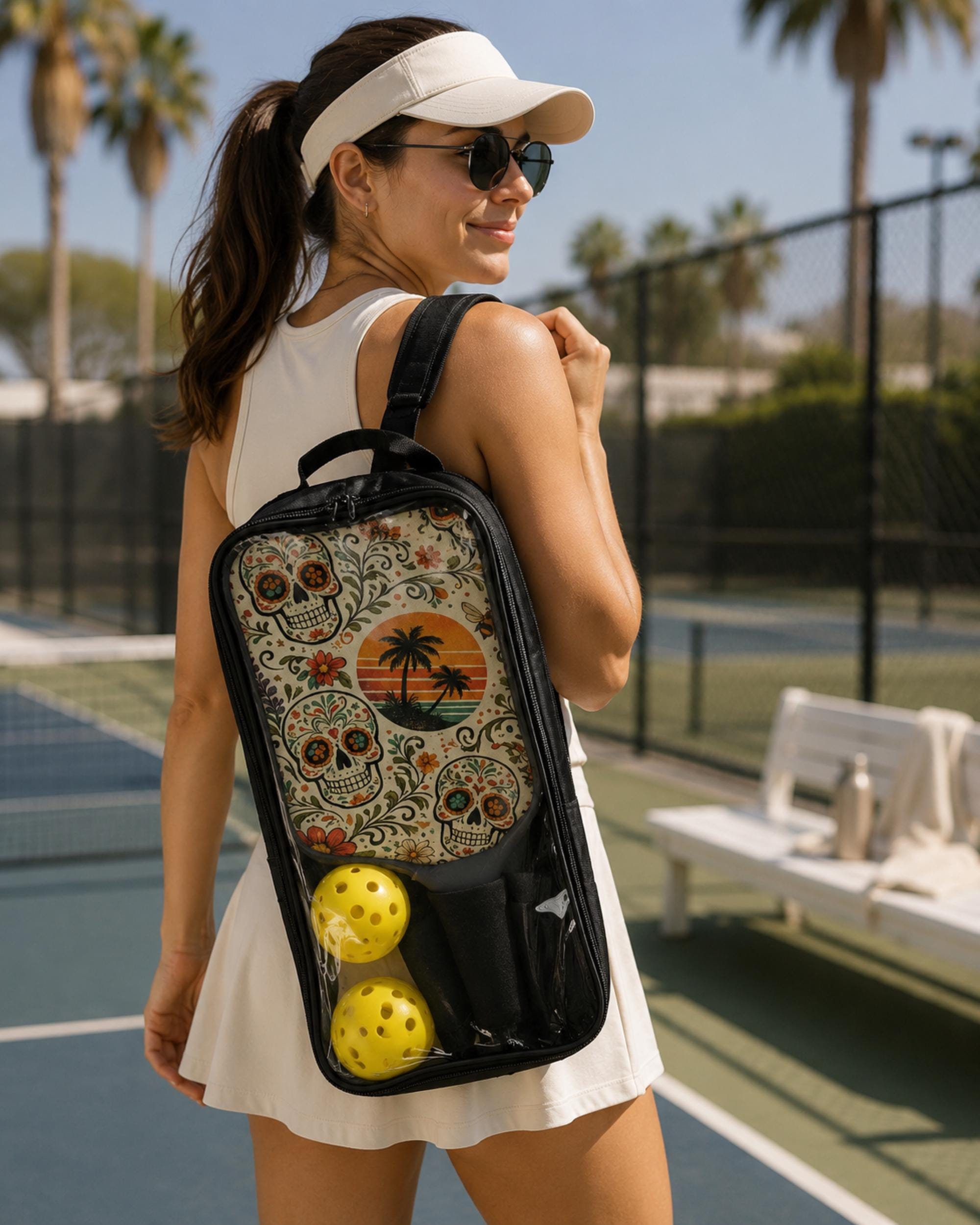 Stylish pickleball paddles with botanical sugar skull design, sunset palm trees, and vibrant vintage-inspired artwork.