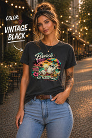 Vintage Black Bella+Canvas t-shirt featuring a relaxing ghost on a tropical beach with the phrase "Beach Please... I'm Haunting."