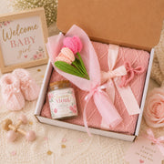 Cozy pink gift box set with soft blanket, Amazing Mom soy candle, crochet flowers, and bow hair clip, perfect for Mother’s Day or thoughtful gifting.