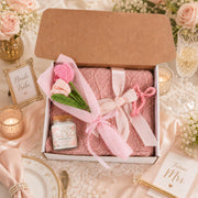 Bridal party gift set with custom Bride Tribe candle label, soft pink blanket, handmade crochet bouquet, and bow hair clip for bridesmaids.