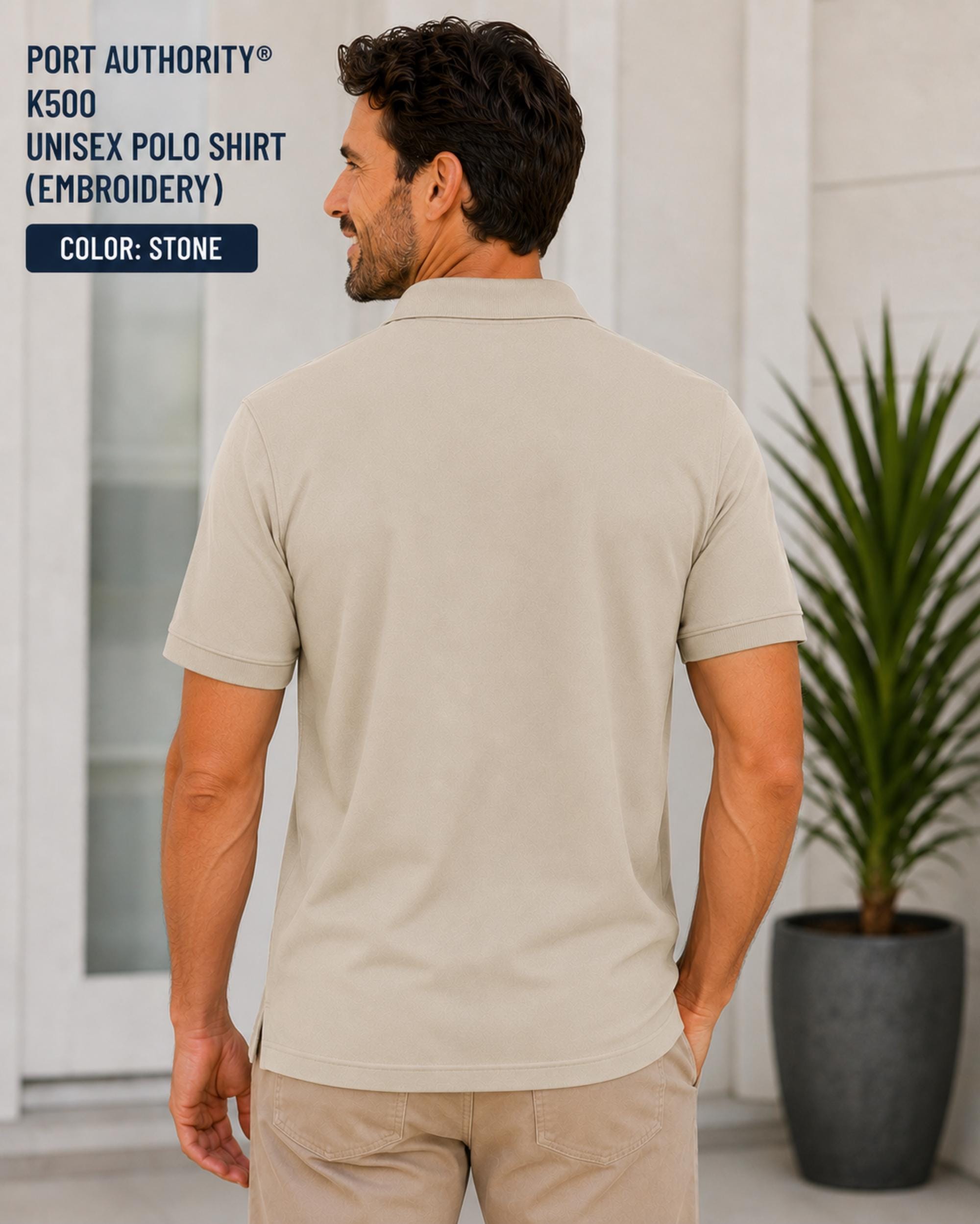 The model showing the back of the Stone Port Authority K500 embroidered golf polo featuring a funny raccoon golfer design with the phrase Putt Happens and Keep Swinging