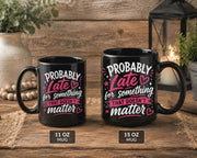 Side by side comparison: Black ceramic coffee mug featuring the phrase "Probably Late for Something That Doesn't Matter" in pink and white typography, available in 11 oz and 15 oz sizes.