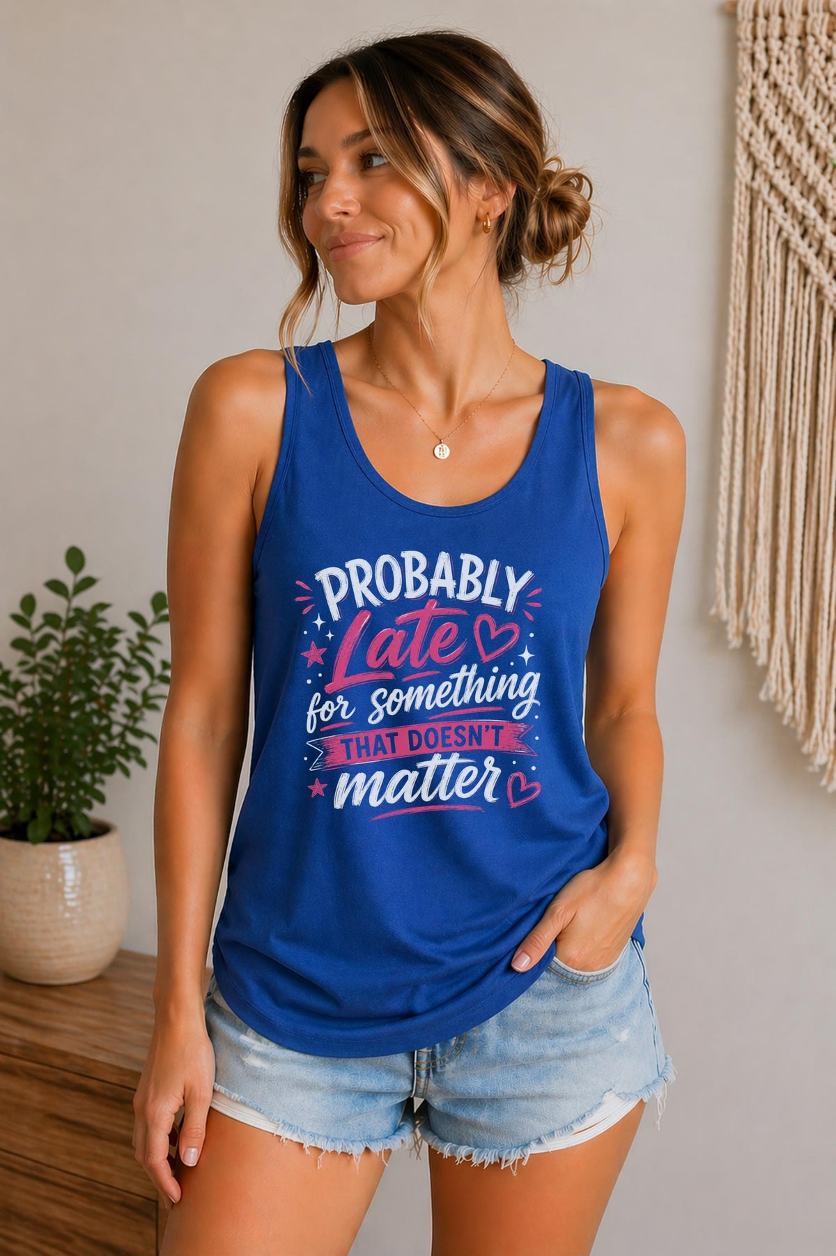 Woman wearing a true royal Bella Canvas tank top featuring the phrase "Probably Late for Something That Doesn't Matter" in pink and white typography.