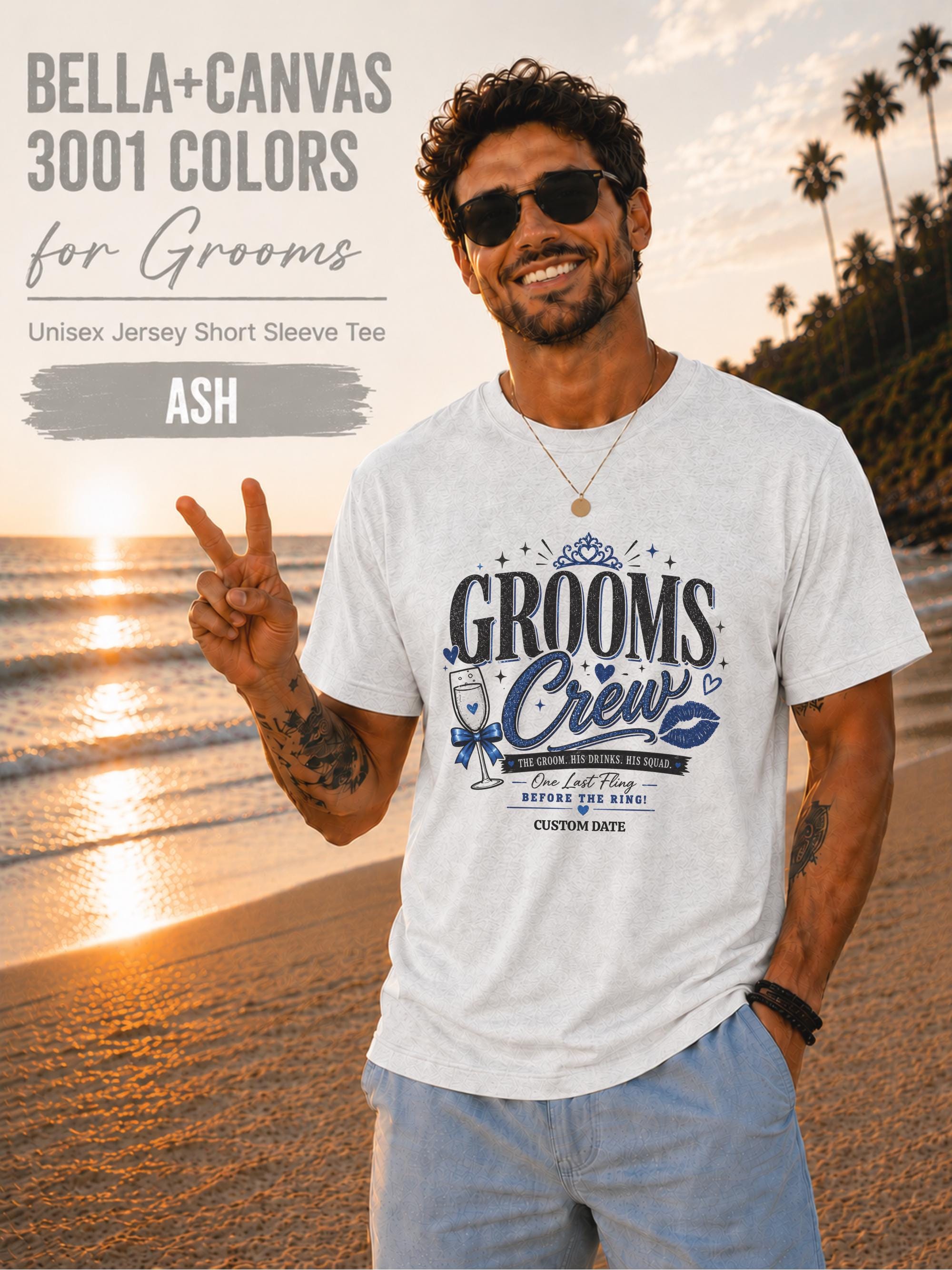 Bella+Canvas 3001 Ash groom crew shirt featuring a blue wedding party design with champagne glass, crown, kiss mark, and customizable wedding date for bachelor party celebrations.