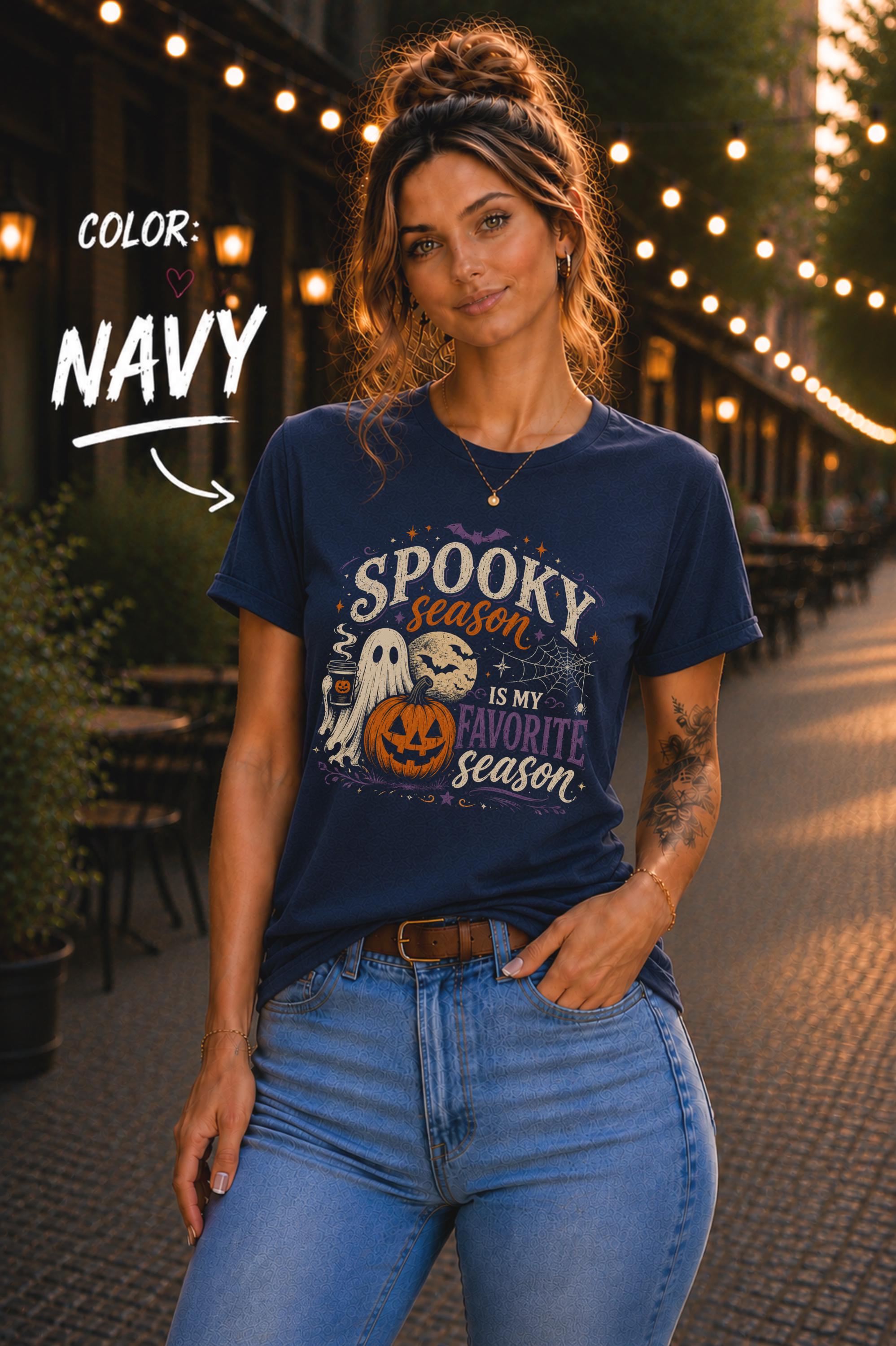 Woman wearing a Bella+Canvas 3001 Navy unisex T-shirt featuring a vintage Halloween design with a cute ghost, pumpkin, spiderweb, full moon, and the phrase "Spooky Season Is My Favorite Season."